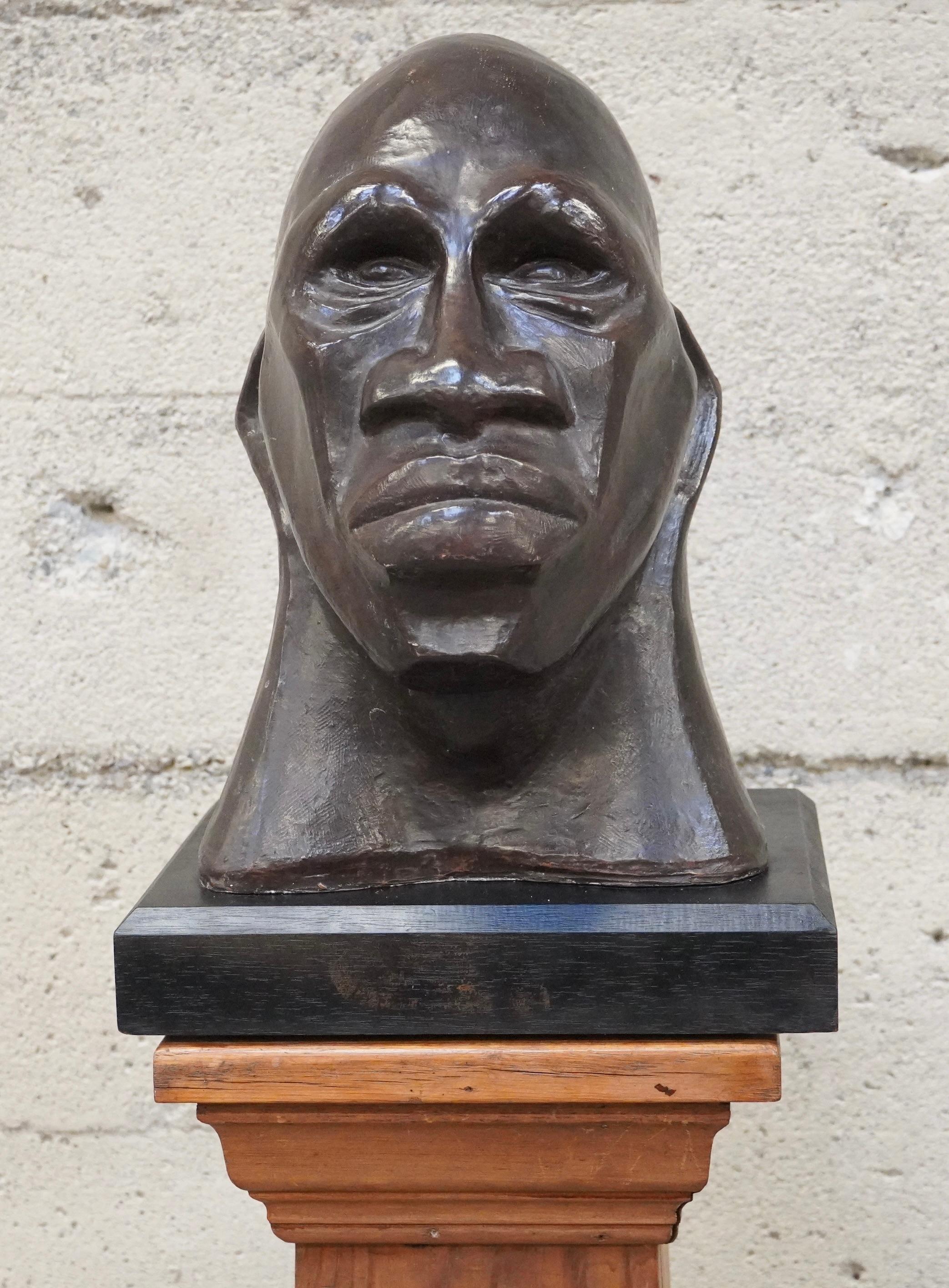 Ceramic bust of an African American, strong imagery done in the Modernist ethos of the Abstractionists, WPA artists of the day. The ceramic bust is mounted on a black painted wooden base. 