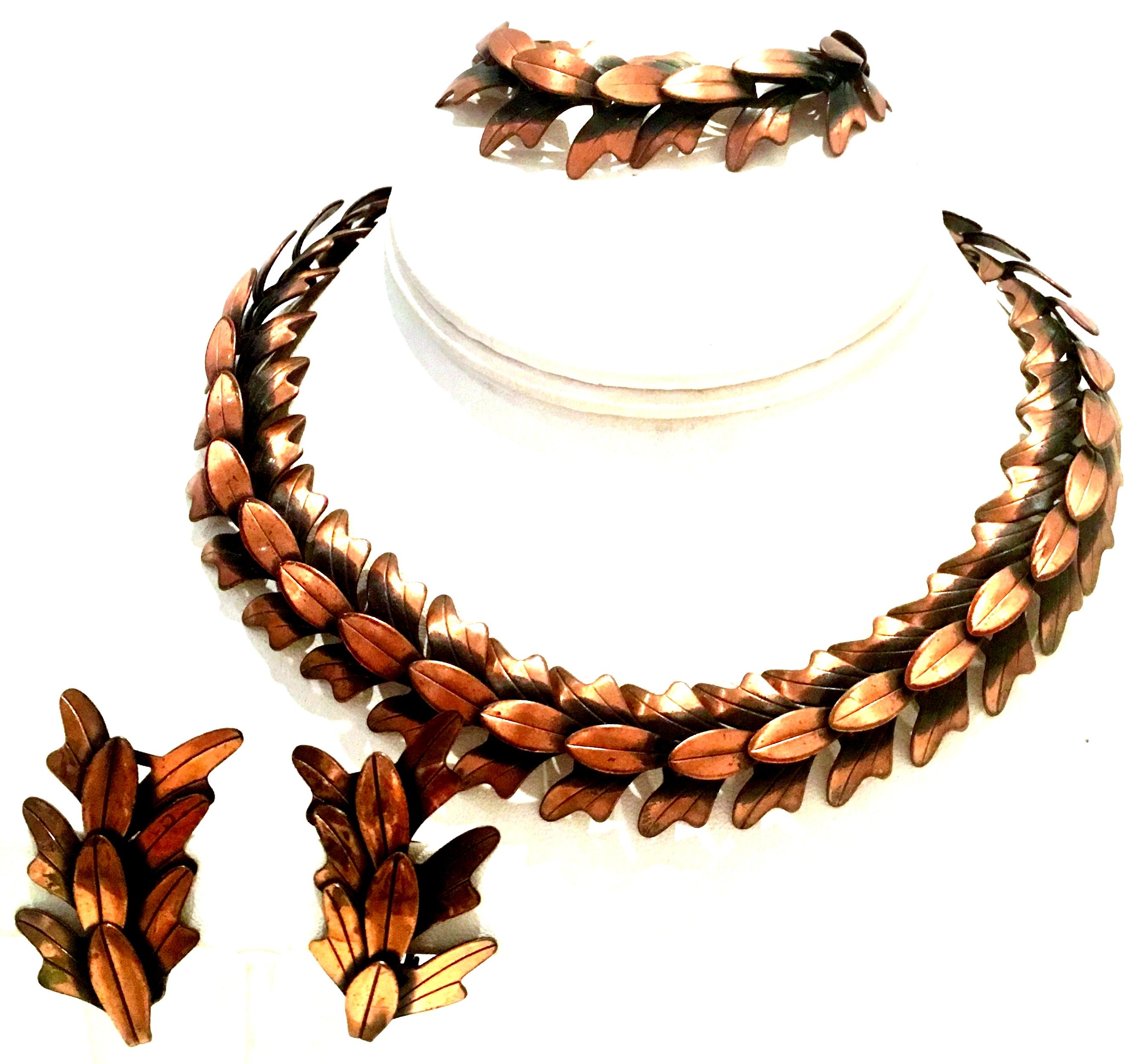 1950'S Modernist Copper Laurel Leaf Full Four Piece Demi Parure Necklace, Bracelet And Pair Of Earrings By, Rebajes. This coveted four piece set features a burnished copper dimensional abstract laurel leaf link choker style necklace, complimentary