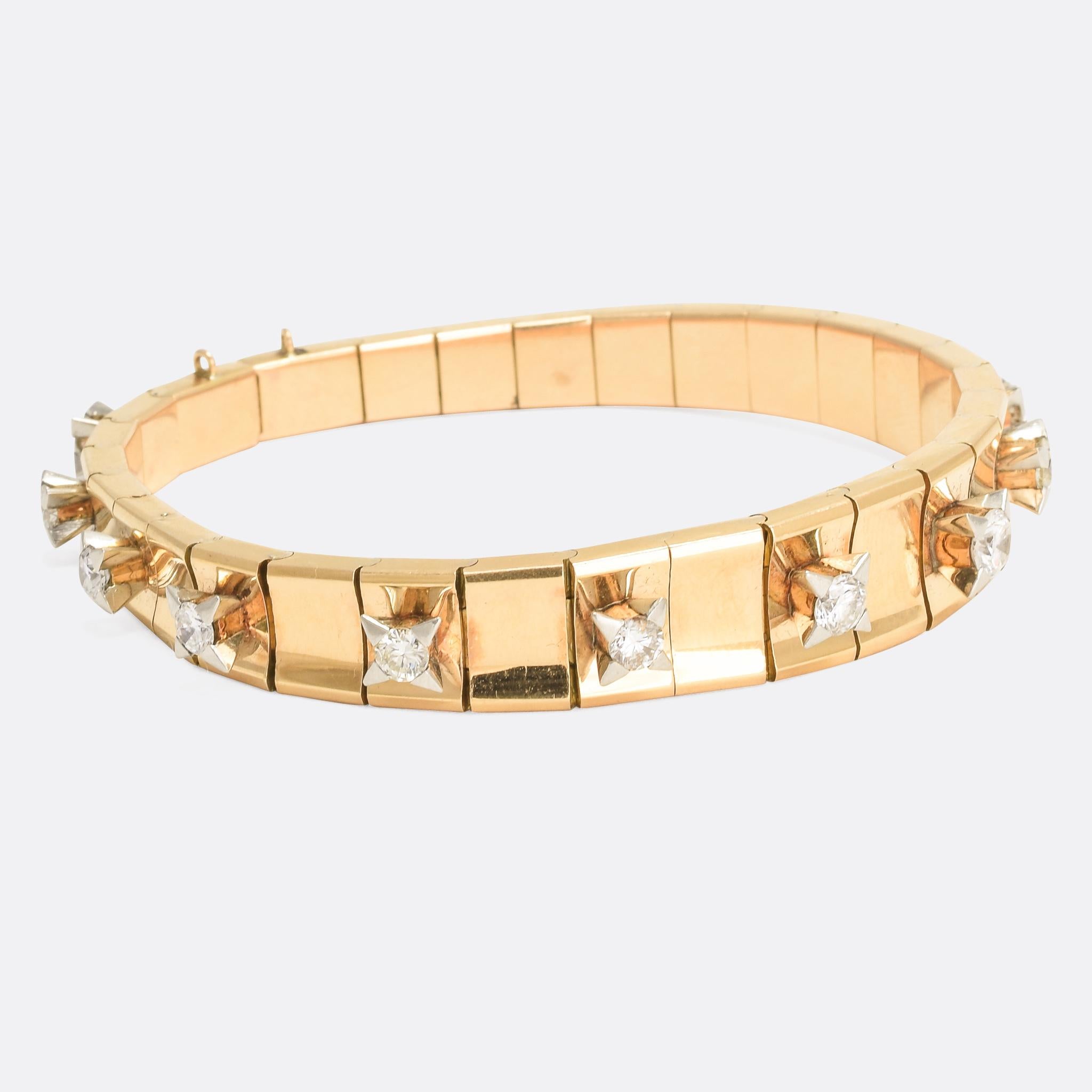 A superb Mid Century Modern diamond bracelet dating from the 1950s. It's exceptionally well made with chunky rose gold links - every other one set with a brilliant cut diamond. It's a stunning statement piece: a striking design and a substantial