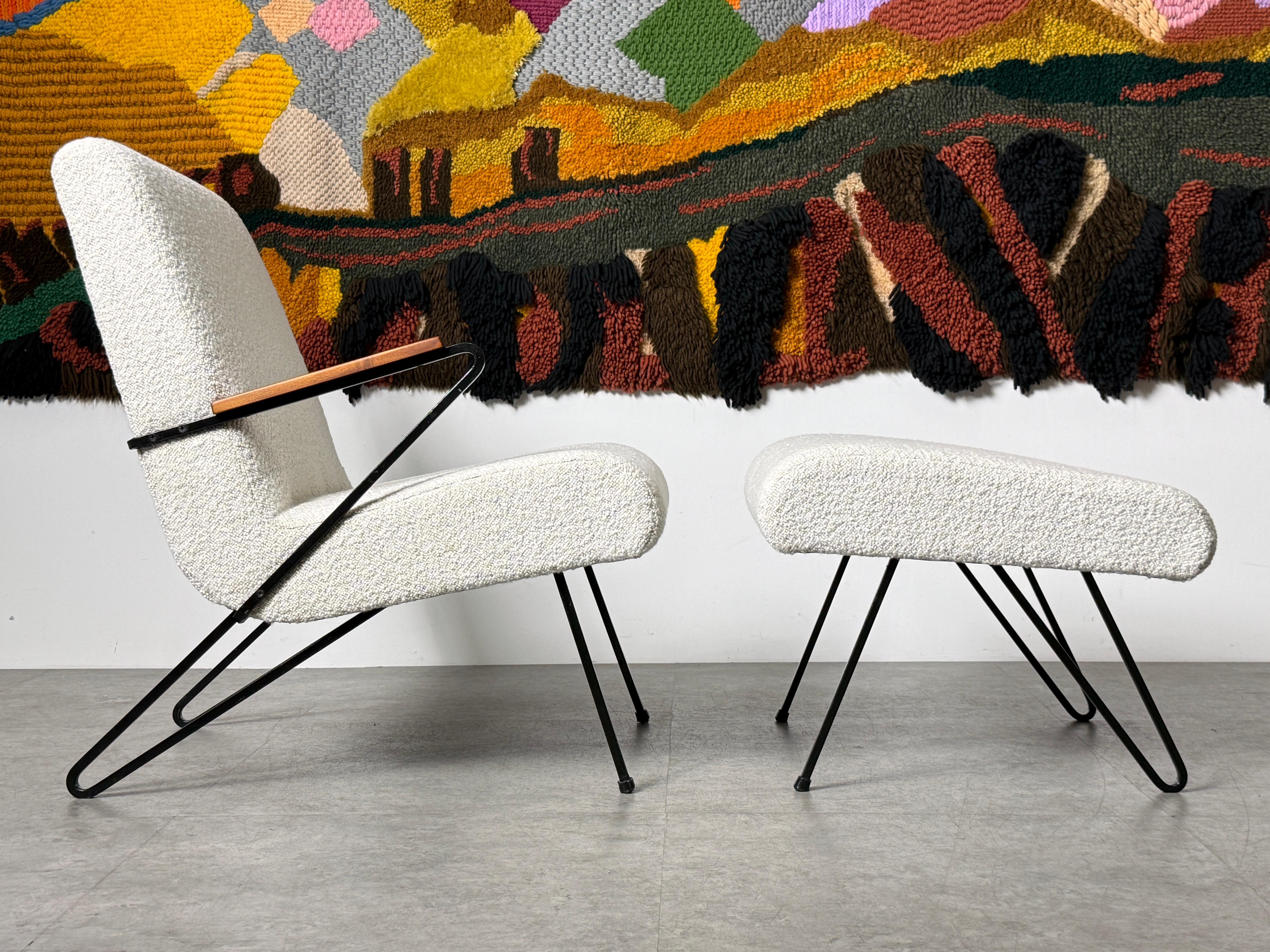 Angular hairpin lounge chair and ottoman in the style of Dan Johnson 
USA circa 1950's

Sculptural iron Z style frame lounge chair with single wooden armrest and sloped seat 
Paired with a matching ottoman in mirrored design

Expertly restored and