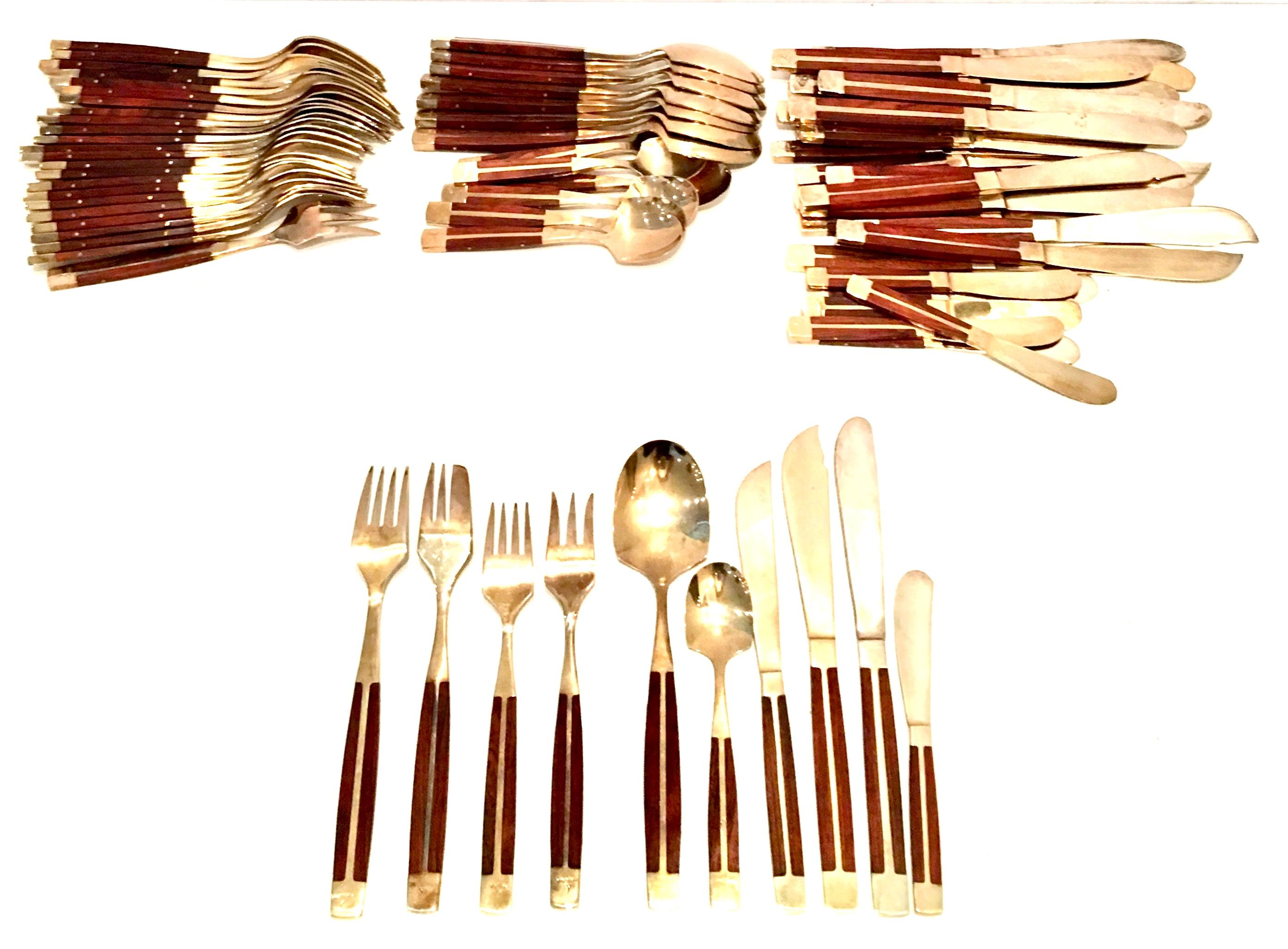 Mid-Century Modernist Rare  Rosewood & Brass Inlay Flatware Set Of Eighty Seven Pieces. Each piece is stamped, Thailand. Set includes:
Eight place/soup spoons: 7.5