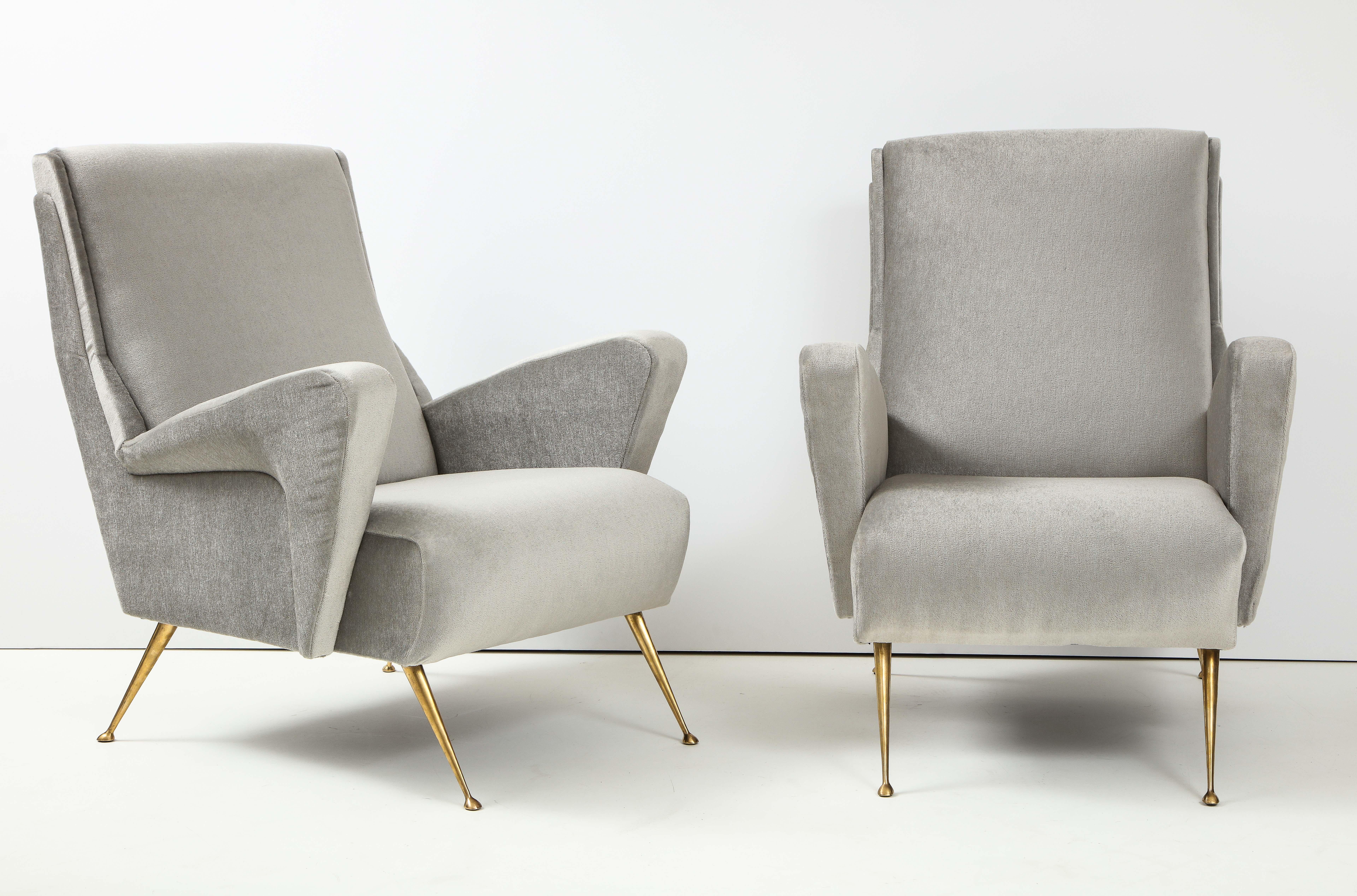 Stunning pair of 1950's modernist sculptural Italian lounge chairs with solid brass legs, fully restored and newly re-upholstered in light gray mohair.