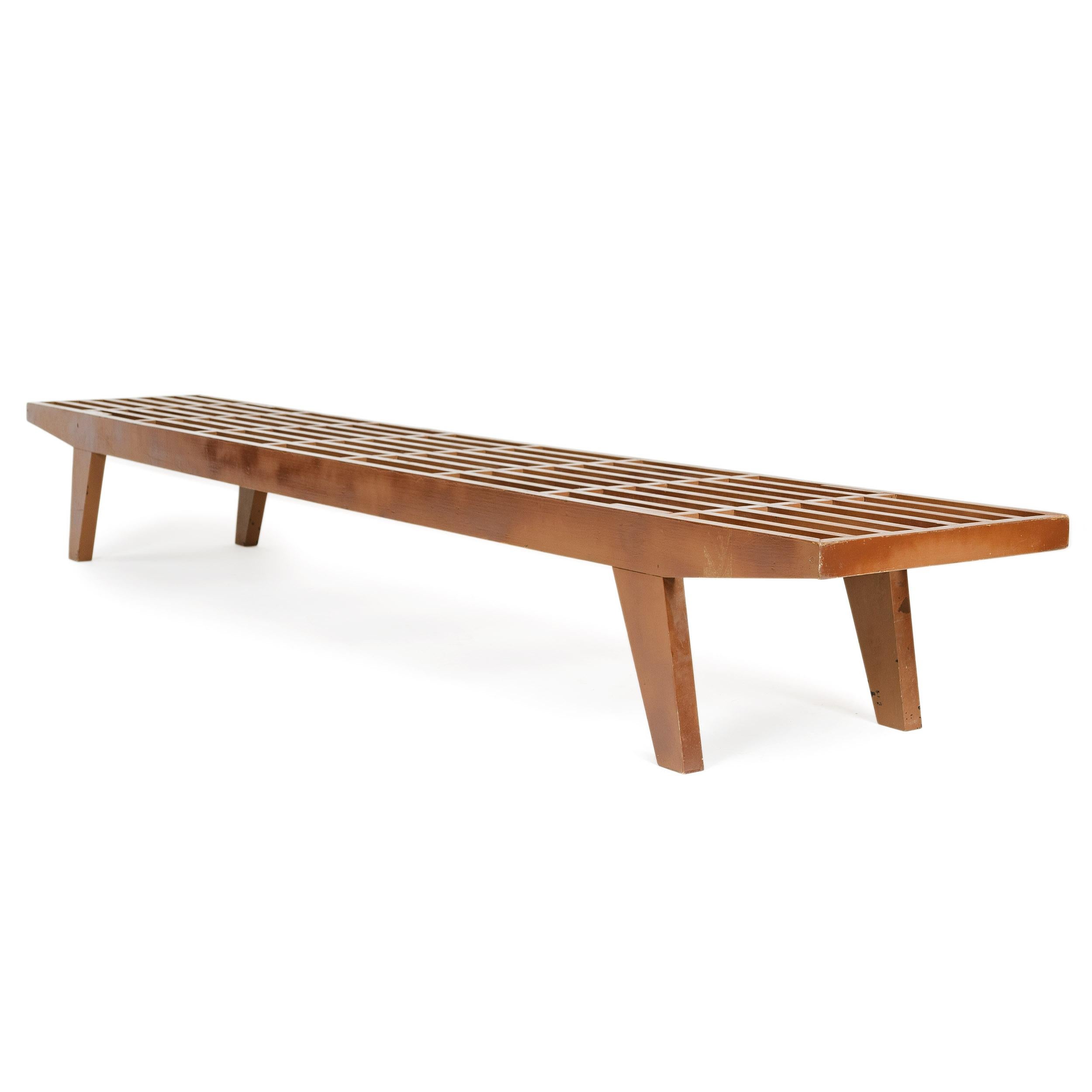 A painted, modernist slat bench or low table.