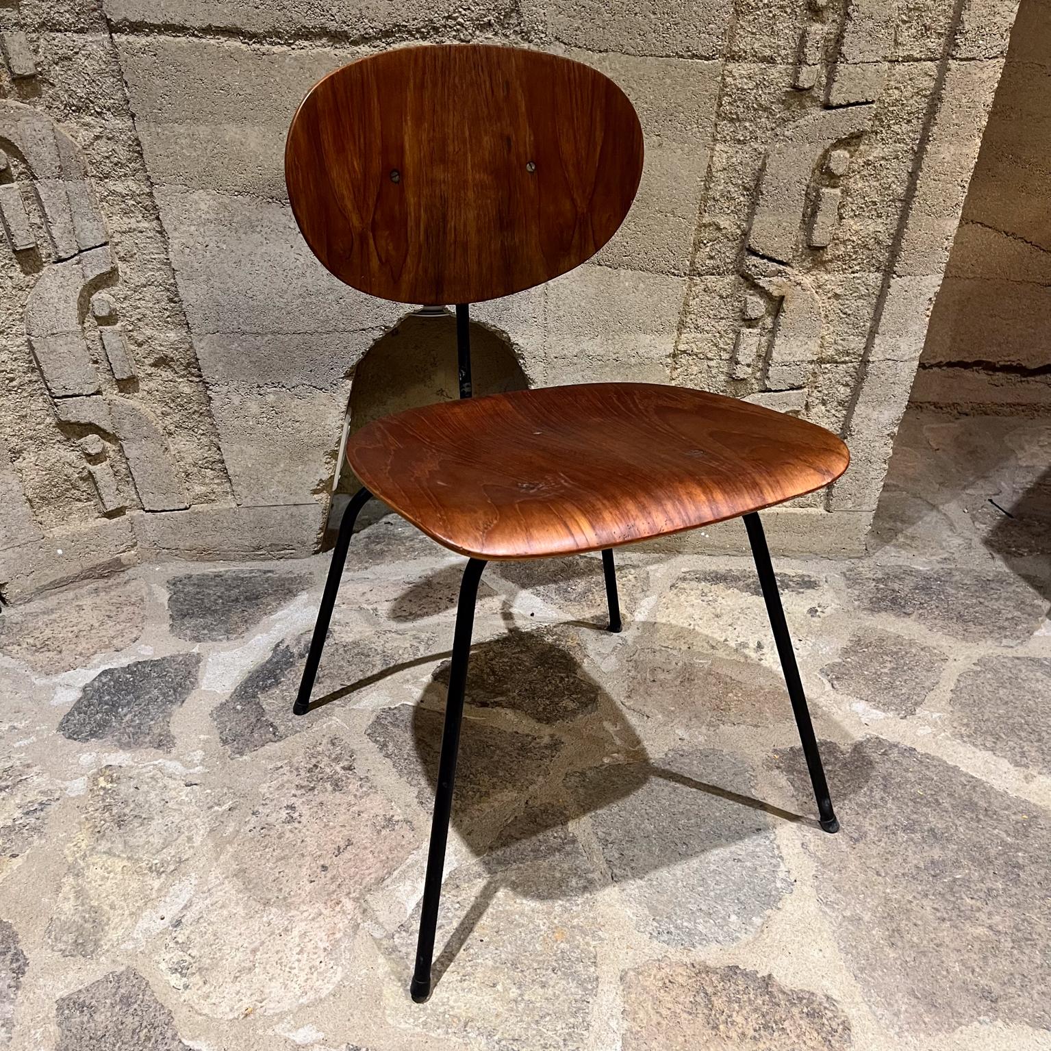 Late 1950s Molded Wood Chair after Eames Herman Miller Knoll
marvelous midcentury chair
Sculptural black Iron base
Features Molded Teak seat and back rest.
No label, chair appears as a prototype.
27.25 H x 26.25 W x 22.75 D, Seat 17.25 H
Unrestored