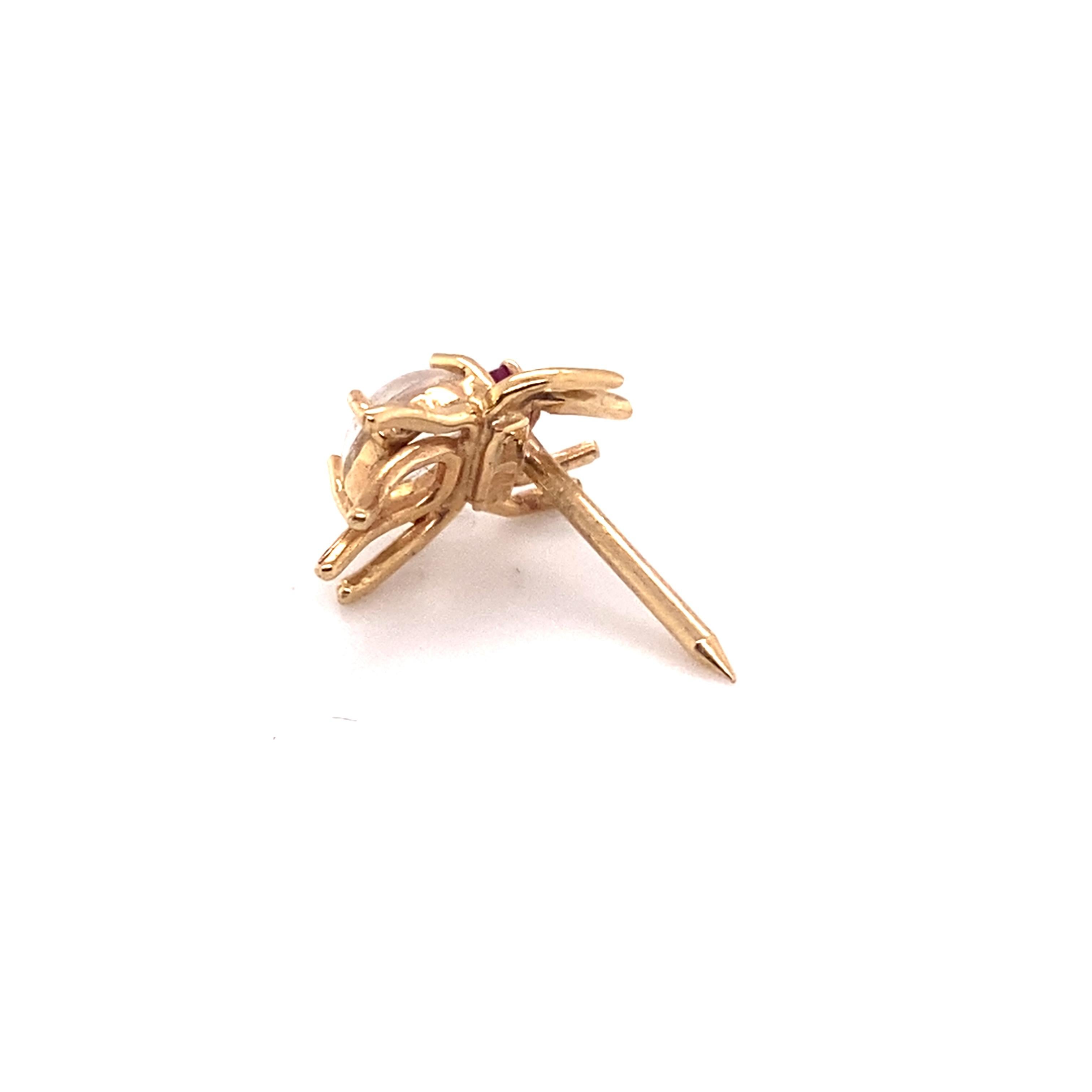 Item Details:
Gemstone: Moonstone & Ruby
Metal Type: 14 Karat Yellow Gold


Item Features: 
This very cute spider pin was made in the 1950s. It features a Cabochon Moonstone in the belly, and a Ruby for the head. the legs and prongs of the pin are