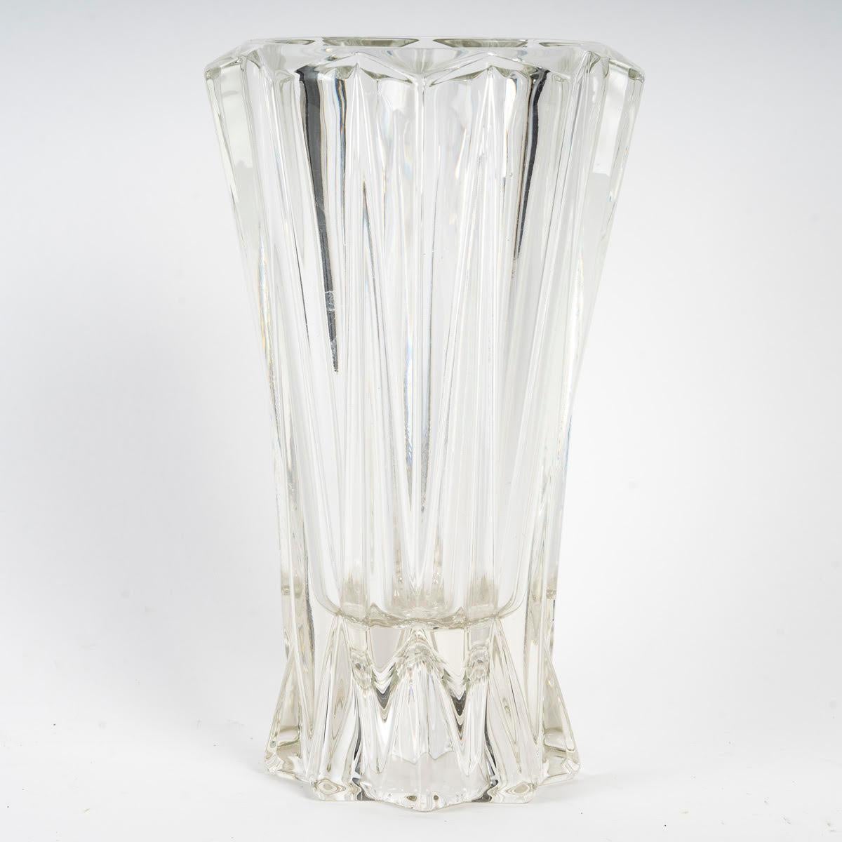1950's moulded glass vase.

1950s moulded glass vase.
h: 22cm, d: 13cm