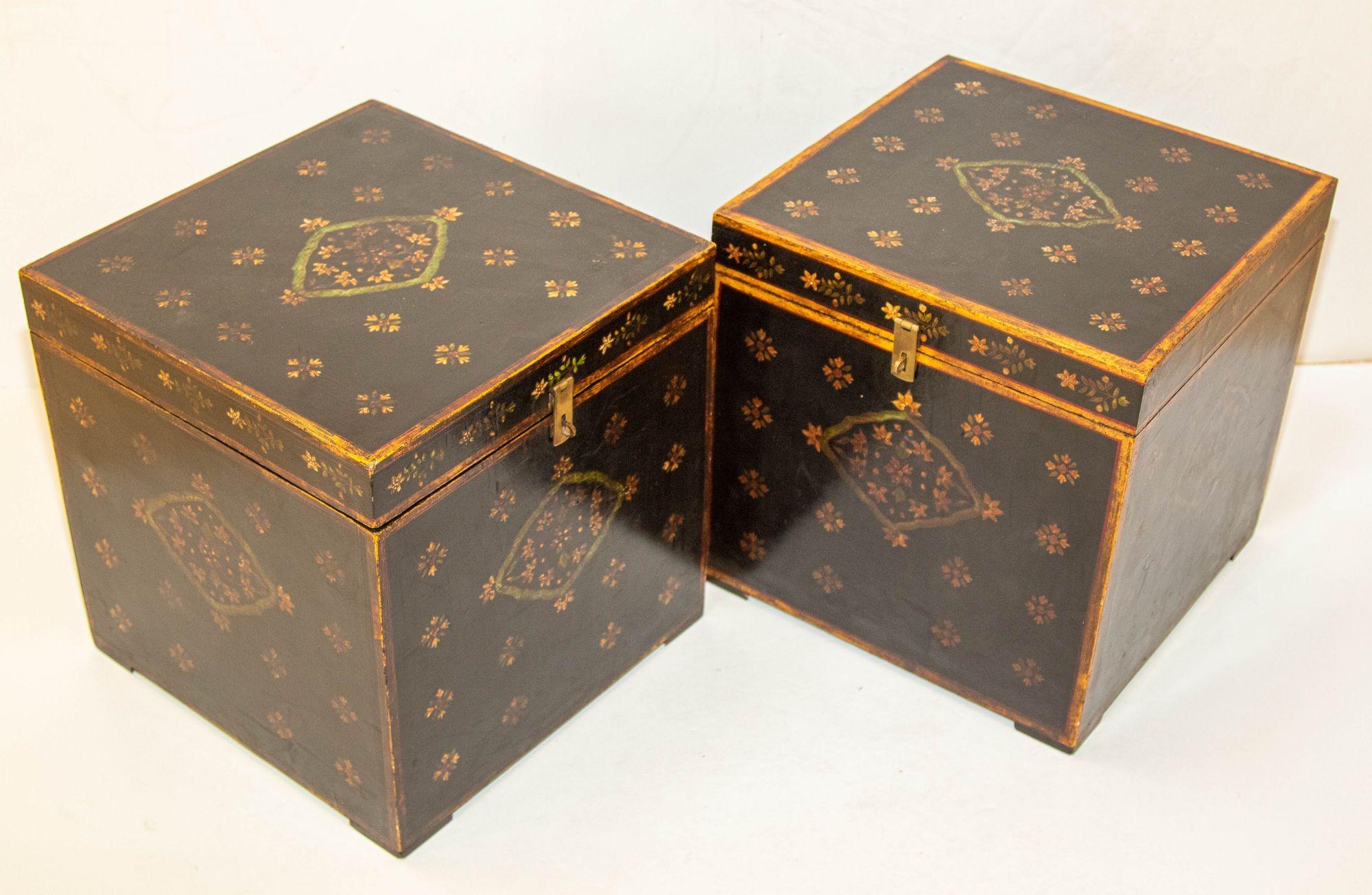 1950s vintage pair of Folk Art lacquer hand painted decorative storage wooden trunks.
Pair of Mughal style small wood trunks with hinged lid clean lines and beautiful floral Rajasthani floral decor, these black lacquered side tables will be an