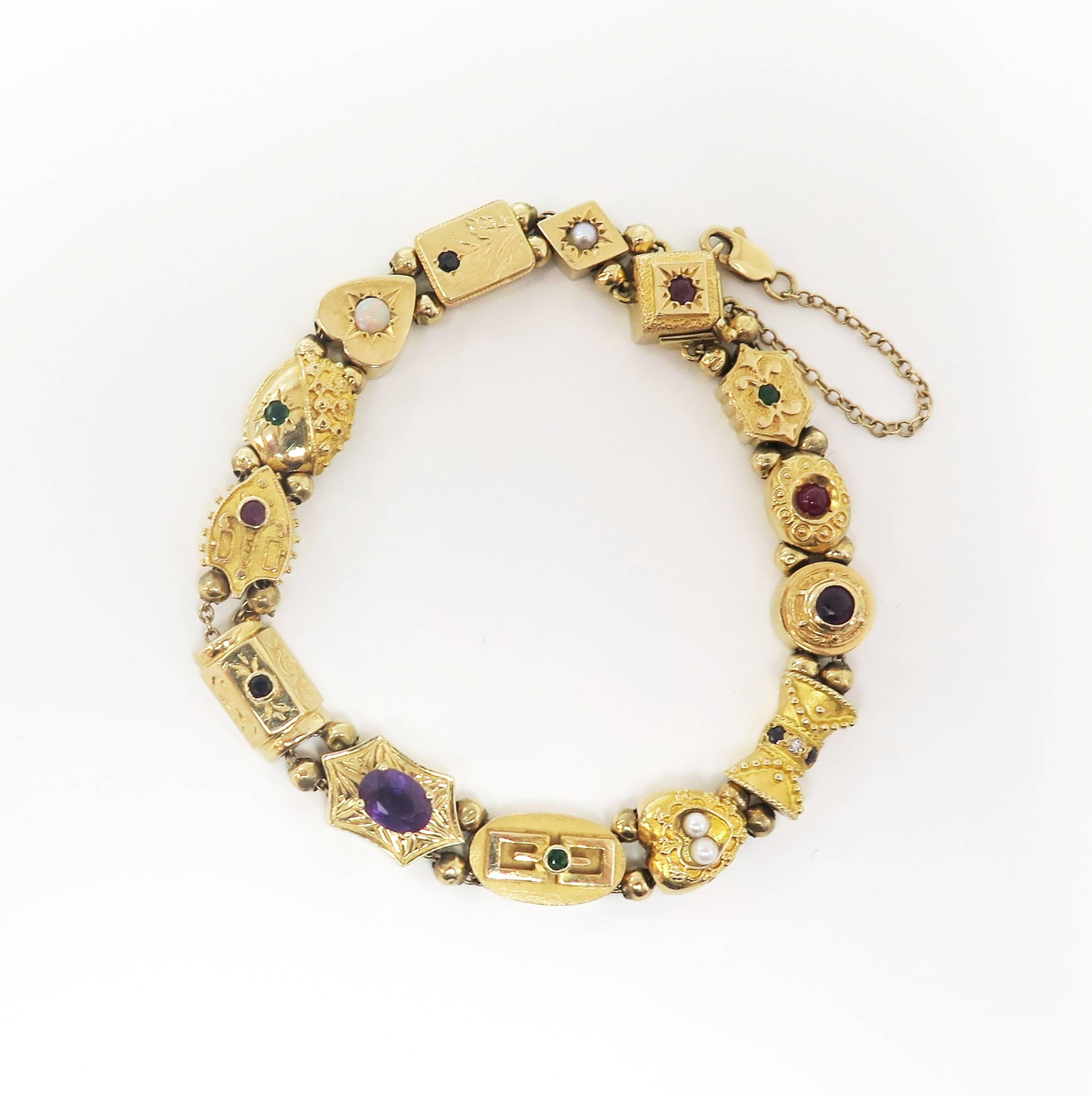 For a short time during the 1950s, nineteenth century Victorian style jewelry enjoyed a strong resurgence, and this classic slide bracelet is a striking example of the favored style. This 14 karat yellow gold bracelet is composed of 14 individual,