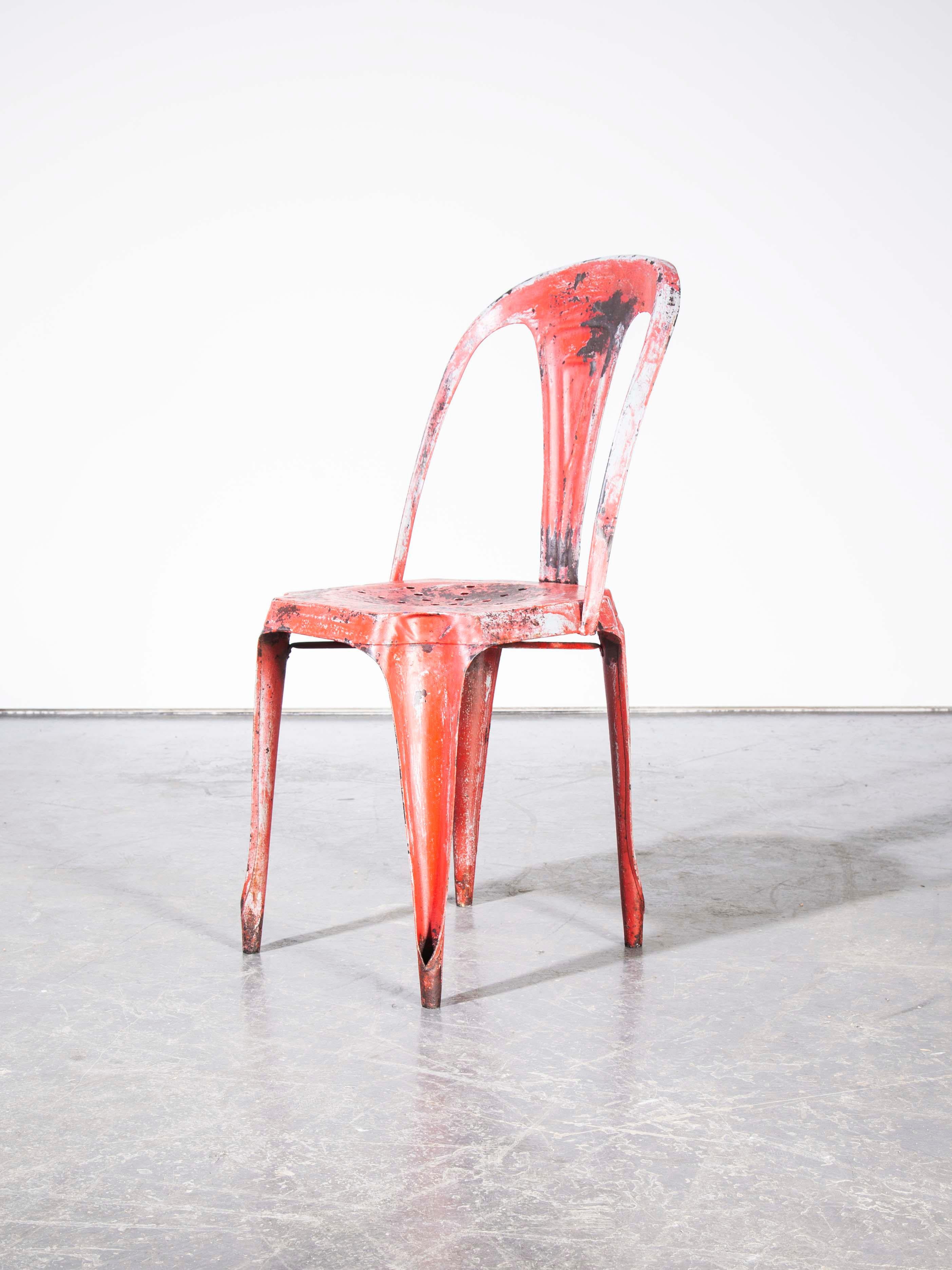1950s Multipl’s red dining chair. Designed by Joseph Mathieu and made in Pierre Benite in Lyon. These chairs are an iconic part of Industrial French History. Each chair was hand pressed in huge industrial presses before being hand welded together.