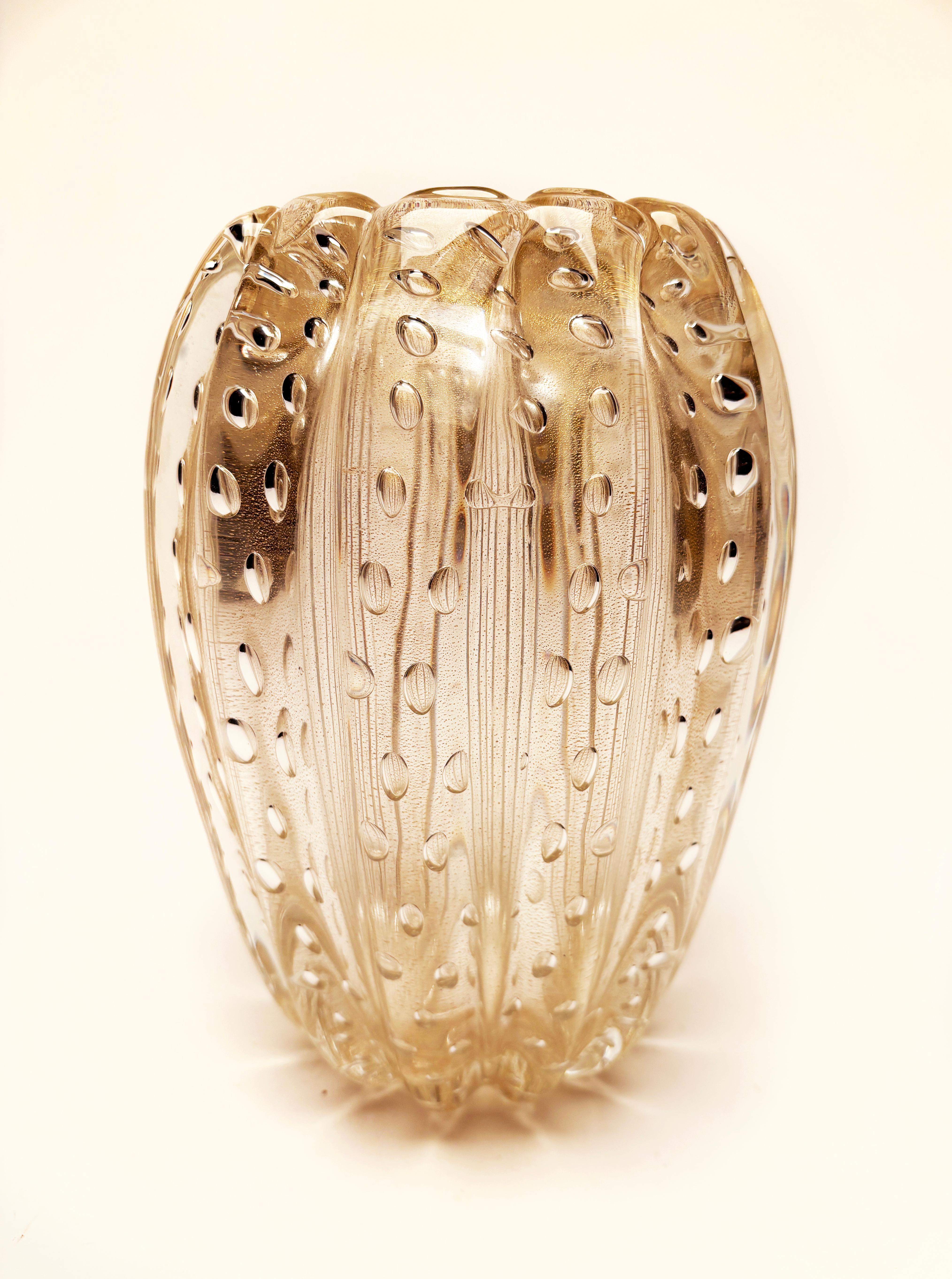 If you could capture the most whimsical moment when golden rain drops fall from the sky and melt into the beautiful bubbling brook below, this might just be the result you would get. Created in the 1950's by Ercole Barcovier for Barcovier & Toso,