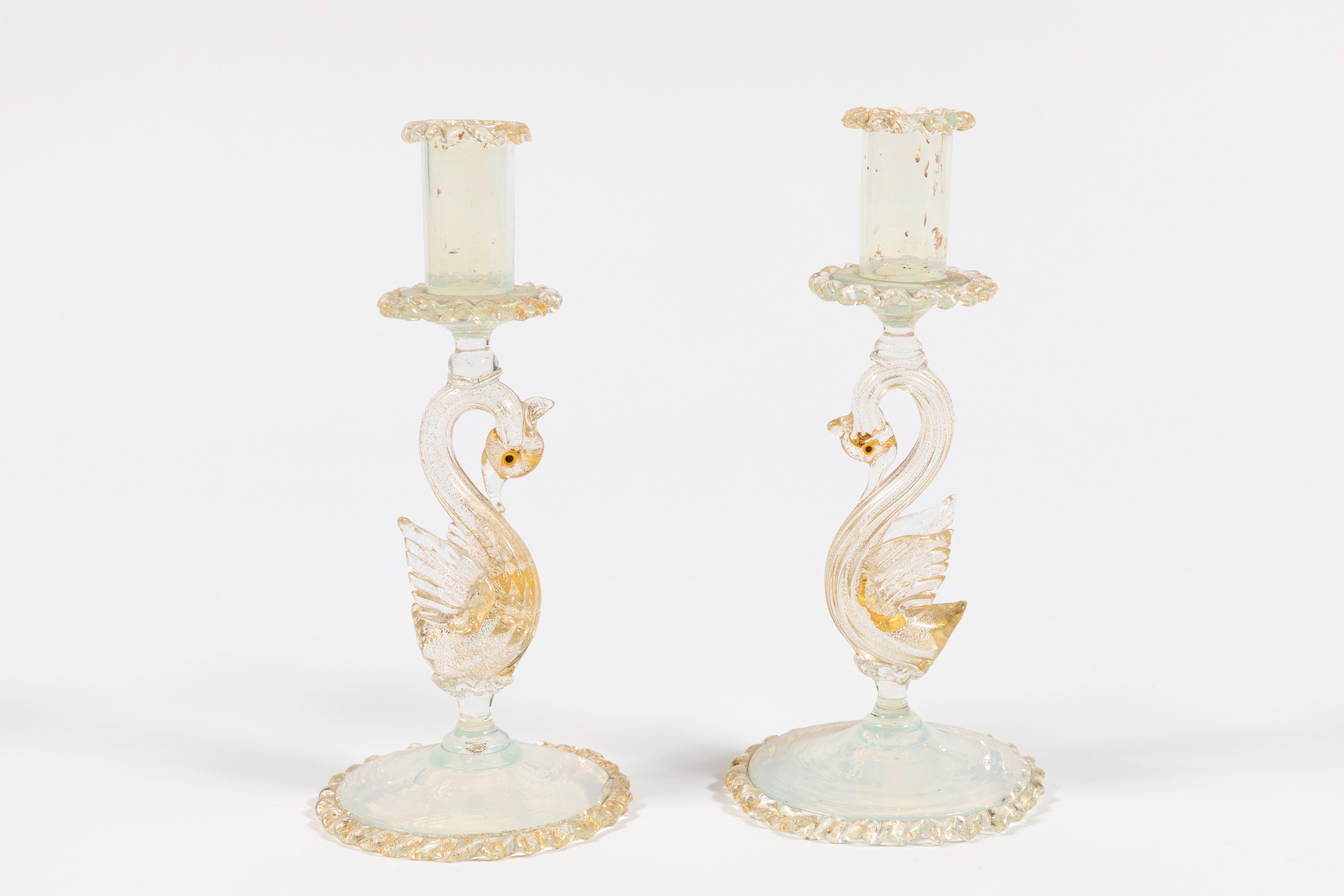 Pair of winged swan candlesticks.  Lots of gold flecks and opaline glass.  Hand blown.  Italian.  Mint condition.