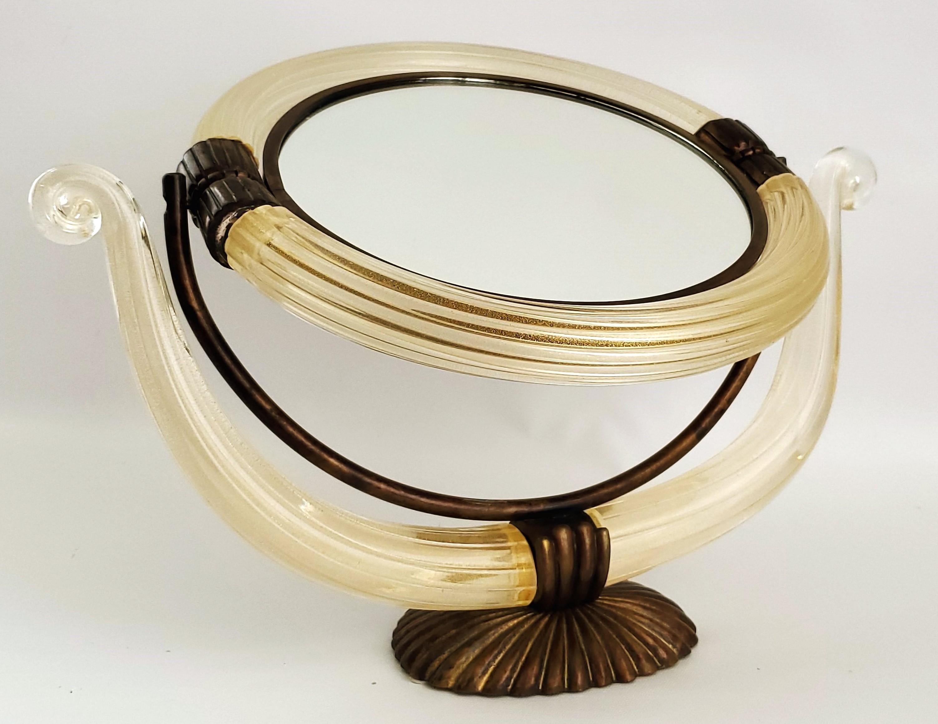 Mid 20th Century Murano glass vanity table mirror made by Barovier, circa 1950s. This remarkable mirror is made with clear ribbed Murano glass with loads of 24K gold flecks throughout the glass. The glass appears light yellow, but in actuality it is