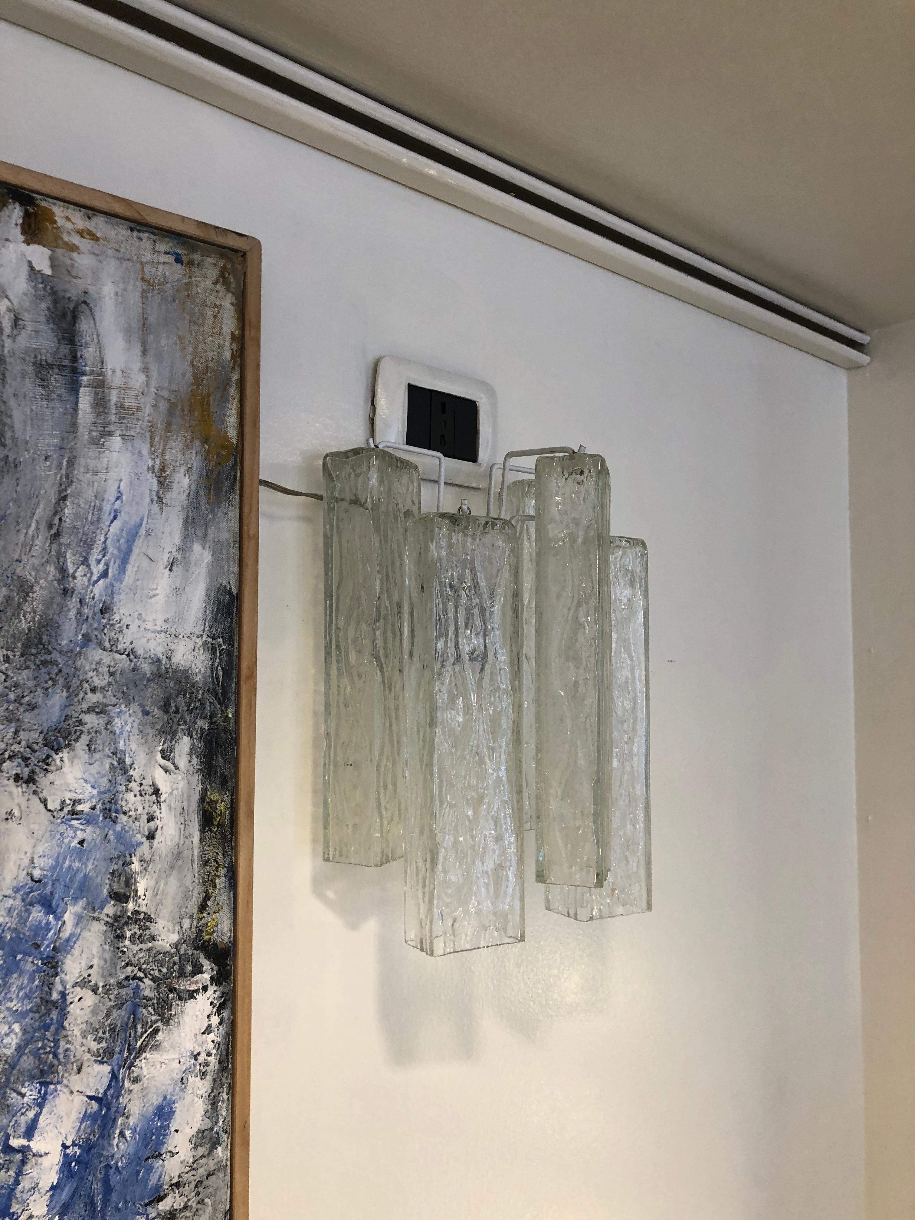 1950s Murano transparent artistic glass wall sconces. A pair of wall sconces composed by different squared elements hung on metal hooks. The lights have been rewired and are ready to be hung.
Very good conditions. A video is available upon