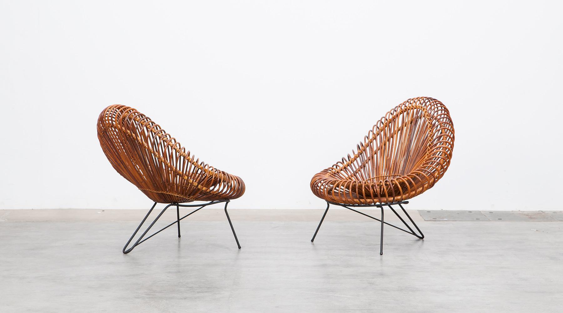 Basket lounge chairs by Janine Abraham and Dirk Jan Rol, France, 1950.

This basketware lounge chairs from 1955 is in excellent original condition, designed by Janine Abraham and Dirk Jan Rol. The elegant basket seat shell is held by black