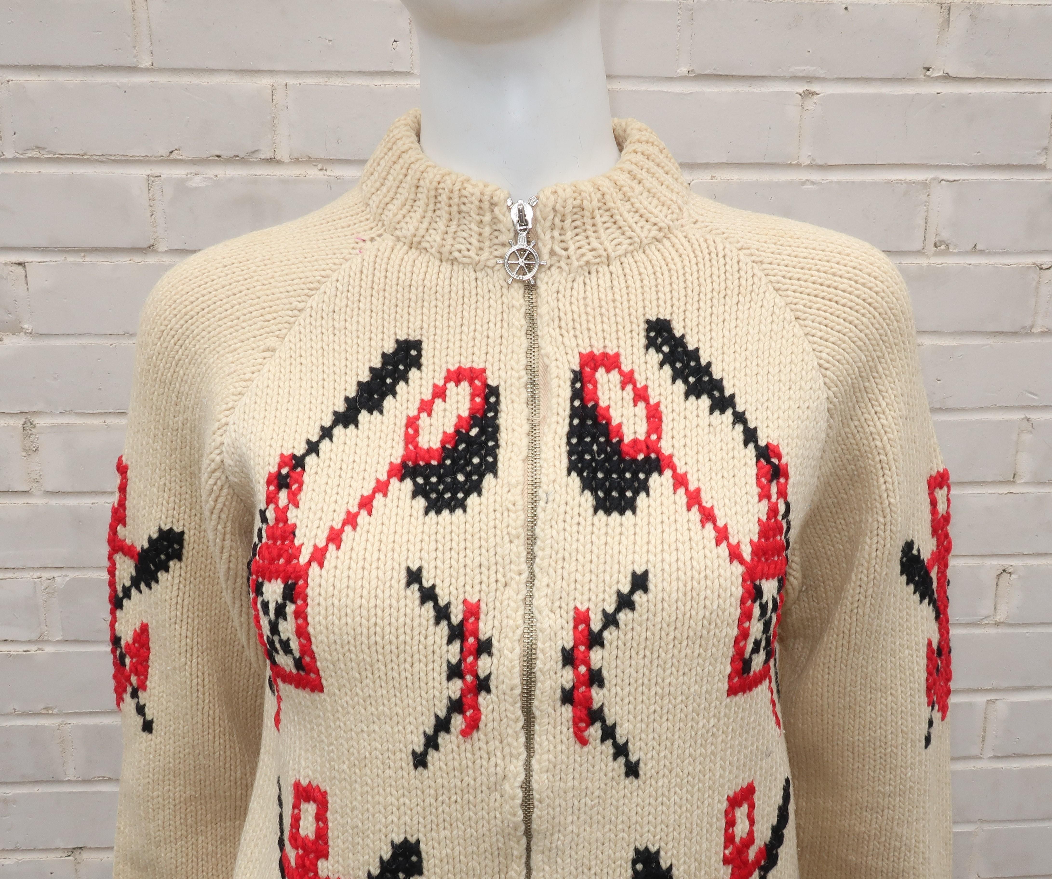 Anchors aweigh!  By the sea or canoeing on your favorite lake ... this chunky hand knit cardigan sweater jacket offers cozy warmth with a charming 1950's style.  The knitted wool design features a red, white (more natural than bright) and blue