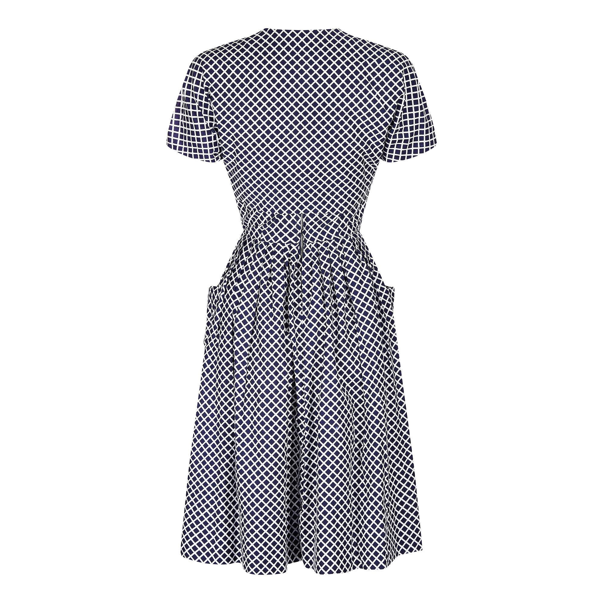 What a fabulous 1950s ensemble of dress and bolero! This set boasts crisp cotton and a great print which is as vibrant as the day the dress was made. In a classic sundress style with a square cut bodice that is beautifully shaped, leading to a full