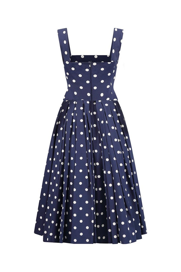 This fantastic 1950s navy and white polka dot prom-style couture dress has magnificent construction and although it is unlabelled I can confirm that it is British made and of exceptional quality. The dress is comprised of thick silk/cotton blend