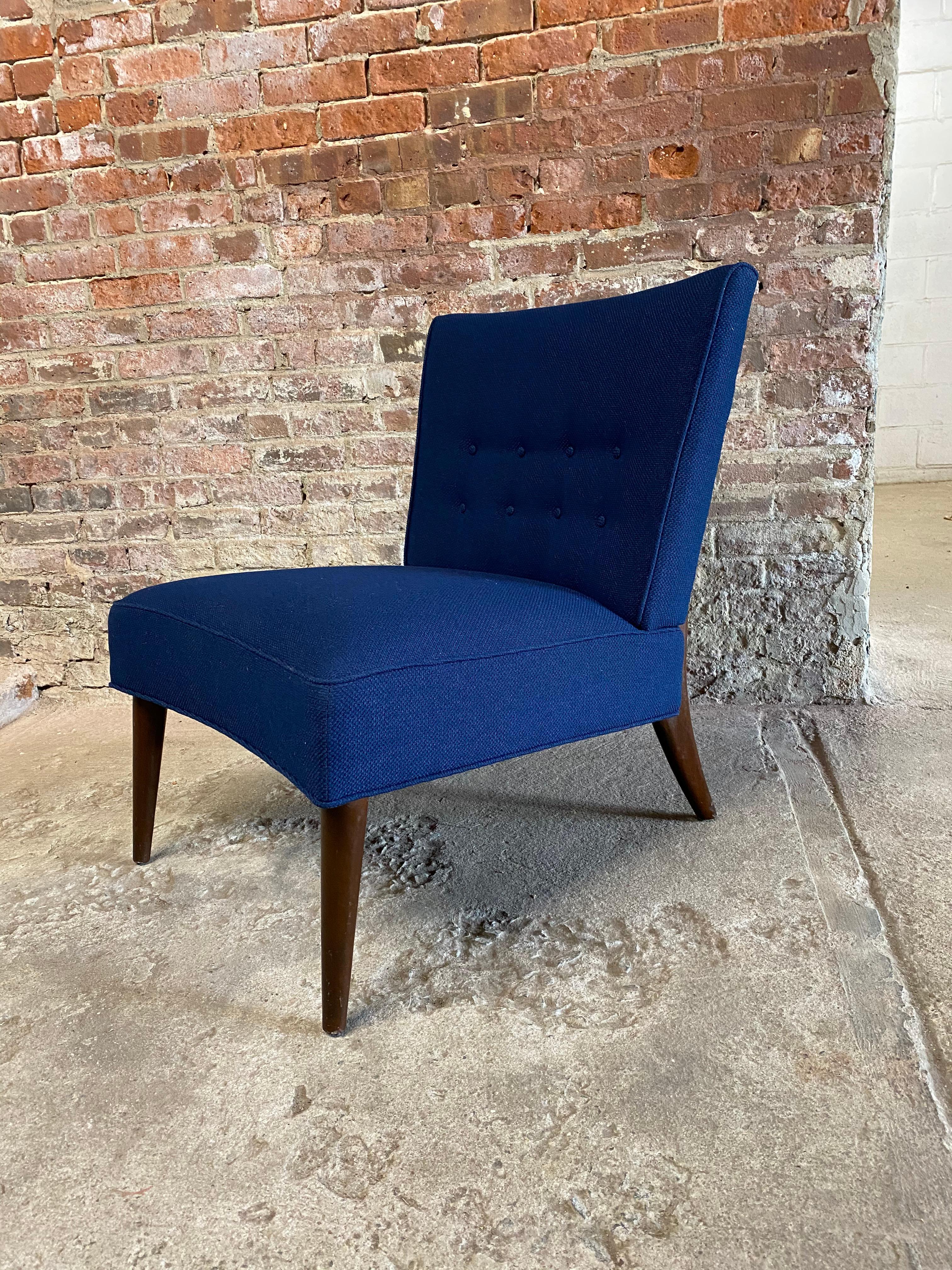 Freshly upholstered in navy blue boucle fabric. Featuring a button tufted back rest, tapered front legs and rear saber legs. Valentine Seaver Originals for Kroehler. Structurally sound and sturdy frame. Maximum comfort, Circa 1950-60.

Approximate