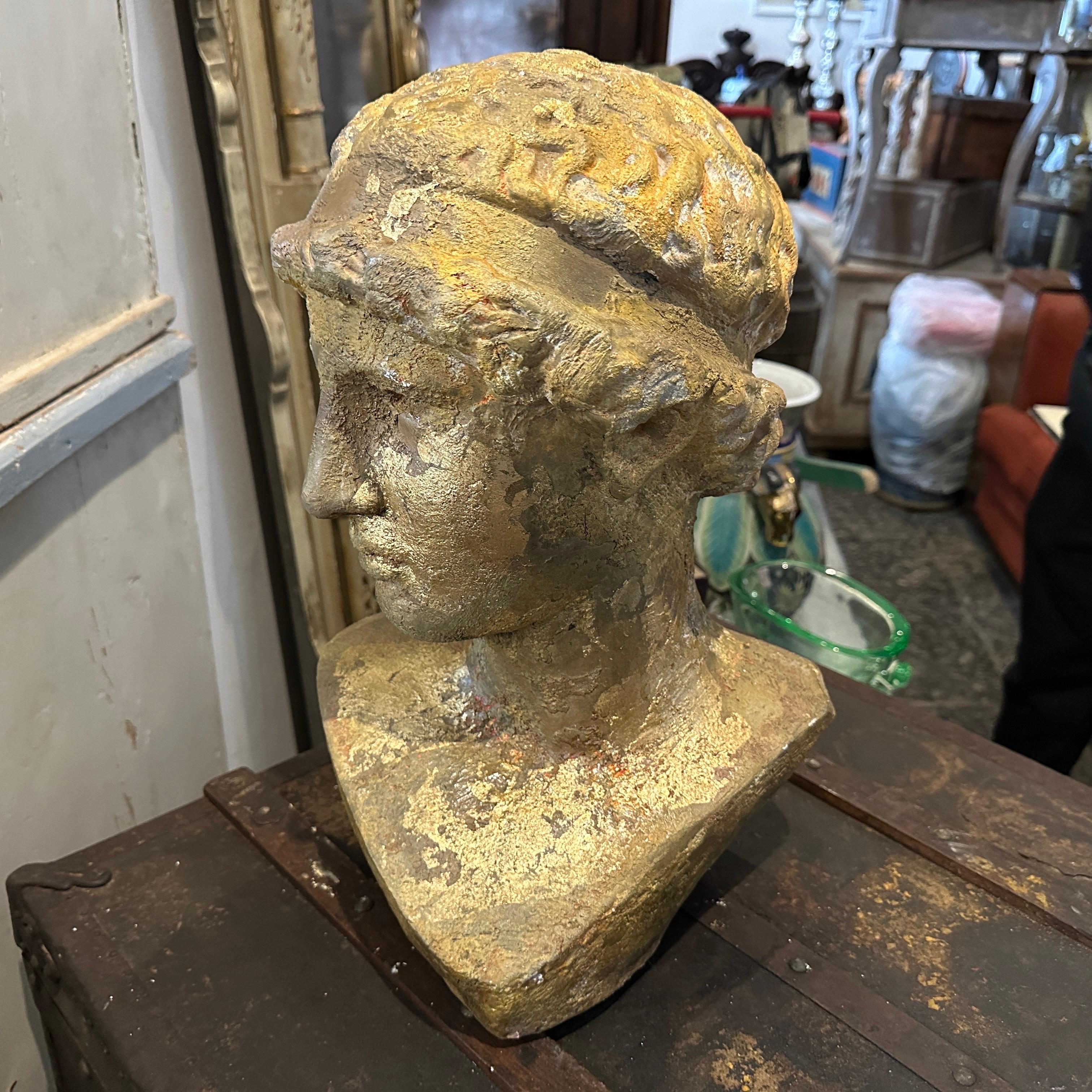 A gold patinated plaster bust of Athena from a Gipsoteca in a sicilian academy of fine arts. They used to patinate the plasters in different ways, this one has been made with gold, amber and brown for this amazing result also given of the time,