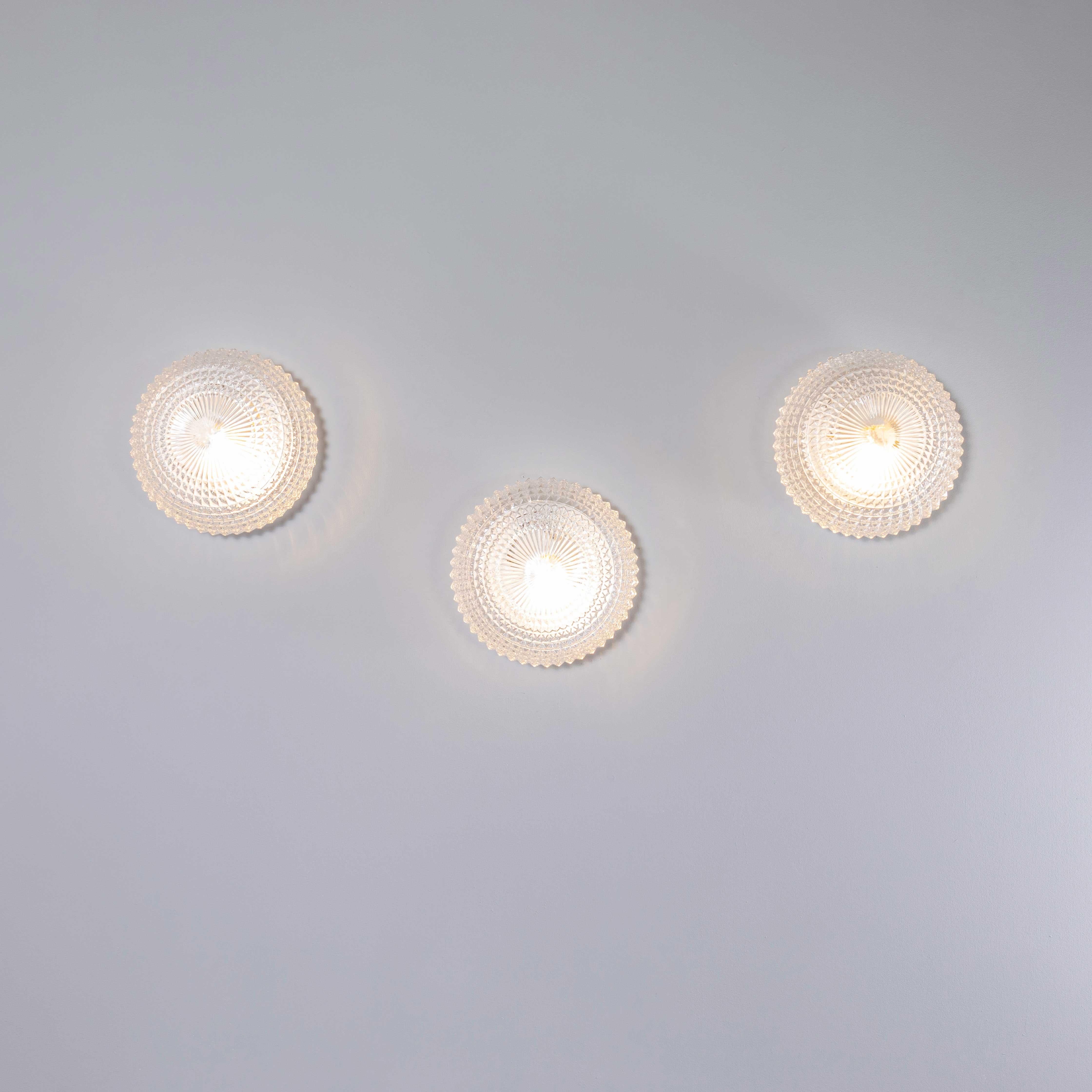 1950’s New Old Stock Czech Clear Domed Diamond Wall – Ceiling Lamp. 
Each lamp has been cleaned and restored. Each lamp is individually wired with new cable and cable connectors to BS EN 60598. The lamp is fitted with a standard E27 threaded lamp