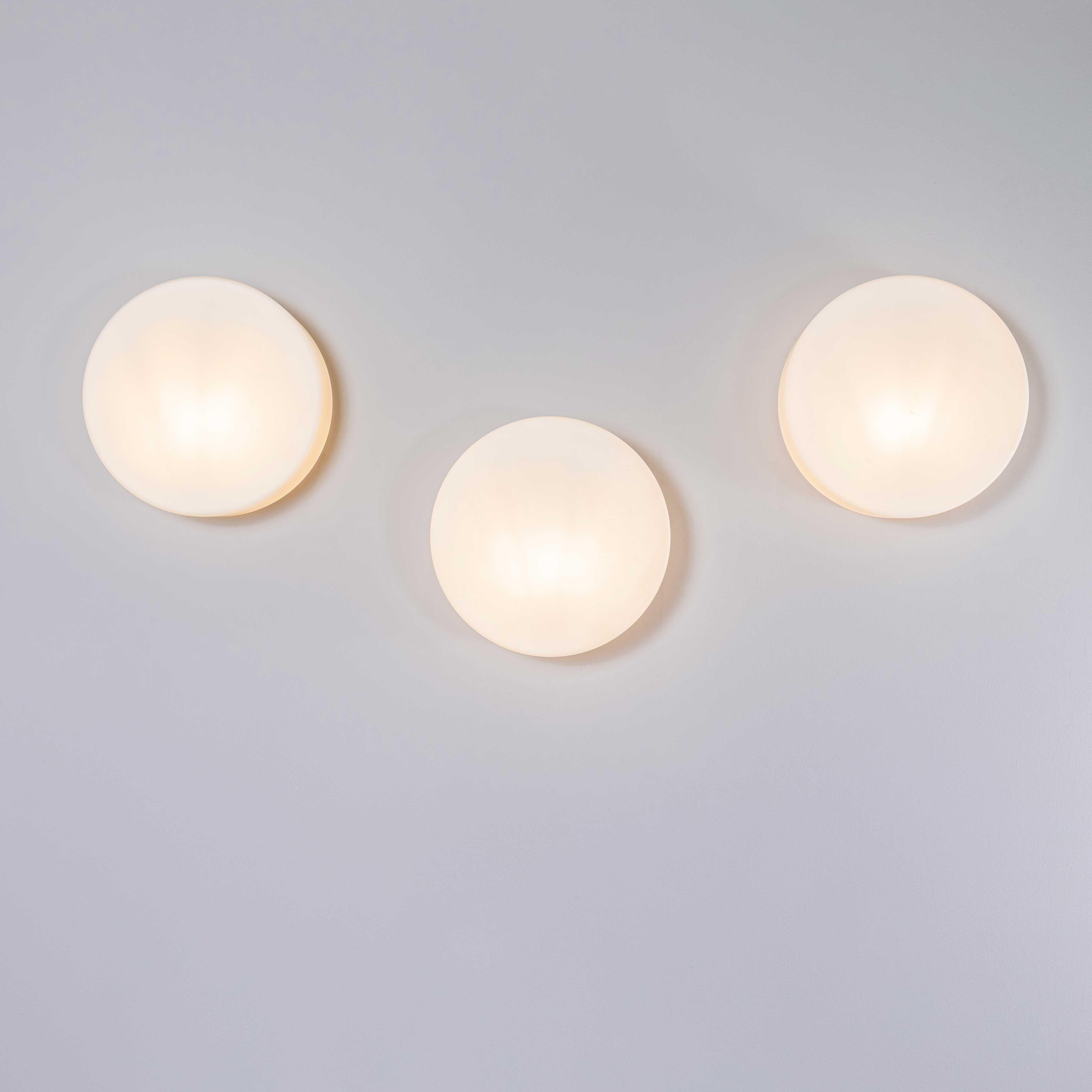 1950’s New Old Stock Czech Opaline Tapered Cake Tin Wall – Ceiling Lamp. 
Each lamp has been cleaned and restored. Each lamp is individually wired with new cable and cable connectors to BS EN 60598. The lamp is fitted with a standard E27 threaded