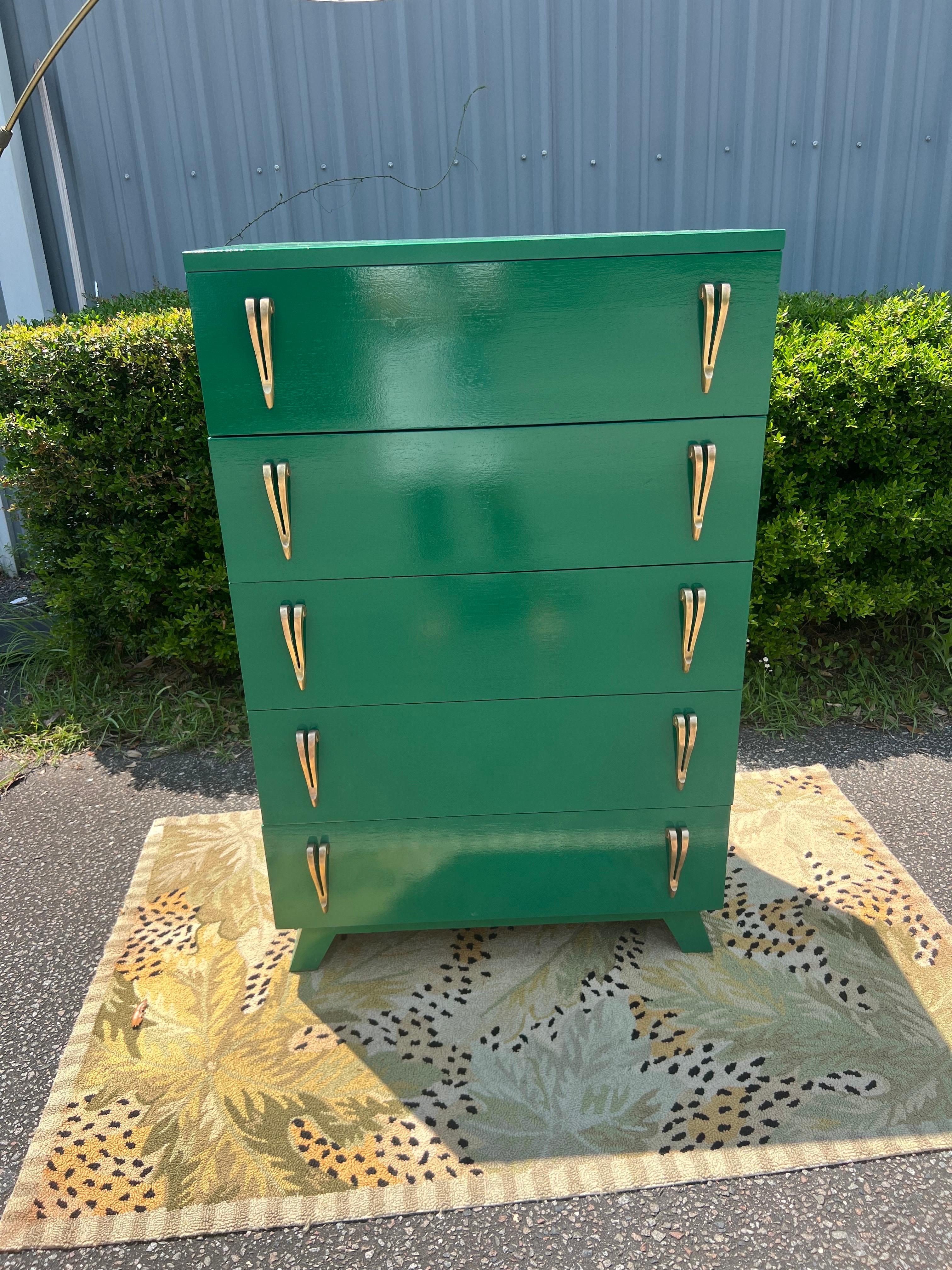 This piece has had a complete overhaul!   This stunning dresser with a very unique base and fantastic pulls, has been carefully restored and lacquered in a gloss Benjamin Moore “Deep Green”. Deep green is described as “A dark, distinguished green
