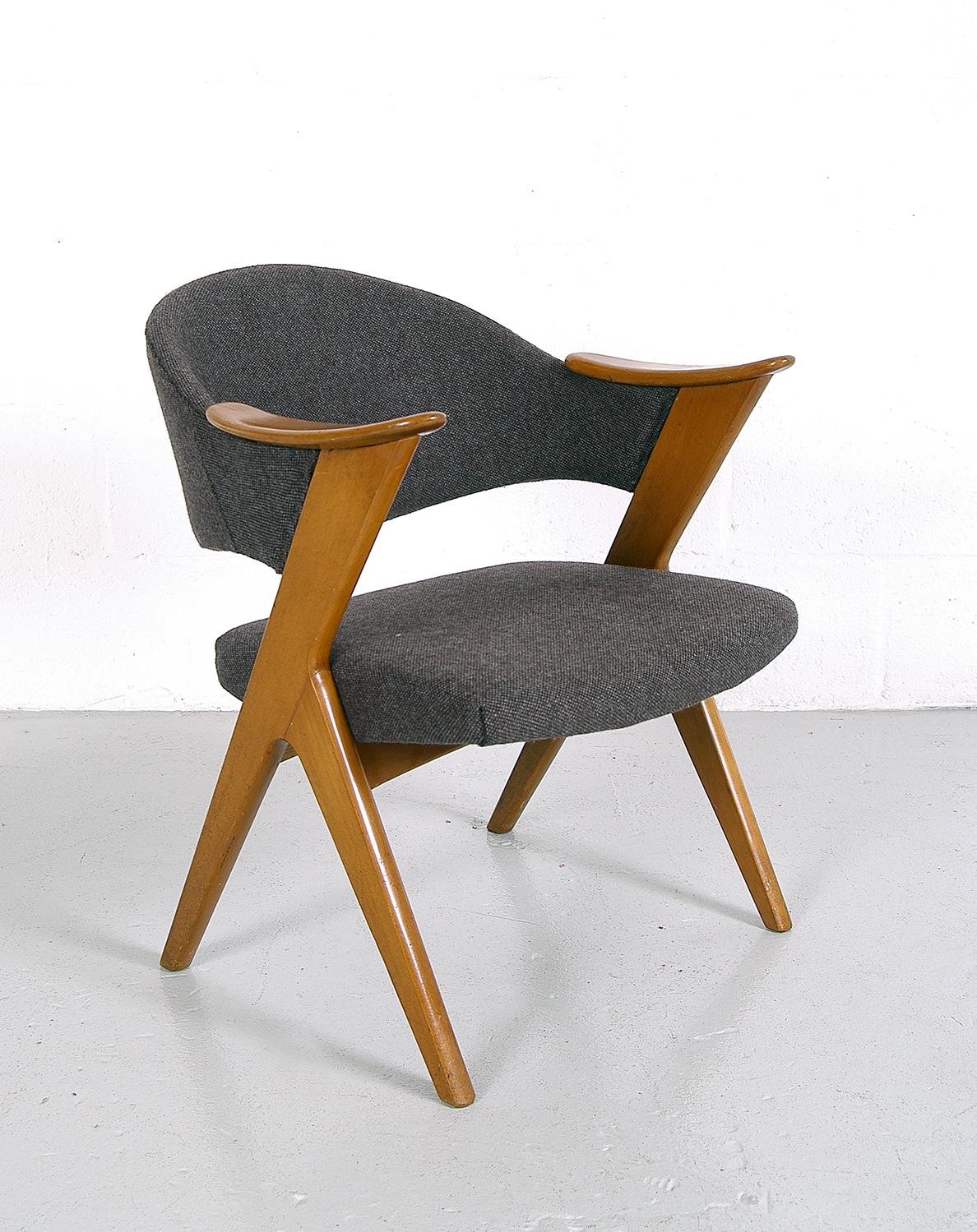 The ‘Blinken’ desk chair was designed in the early 1950s by Rolf Rastad and Adolf Relling for Hjellegjerde Mobler of Norway. It's very comfortable and in really nice condition, the grey woolen tweed upholstery looks to be relatively recent, as it is