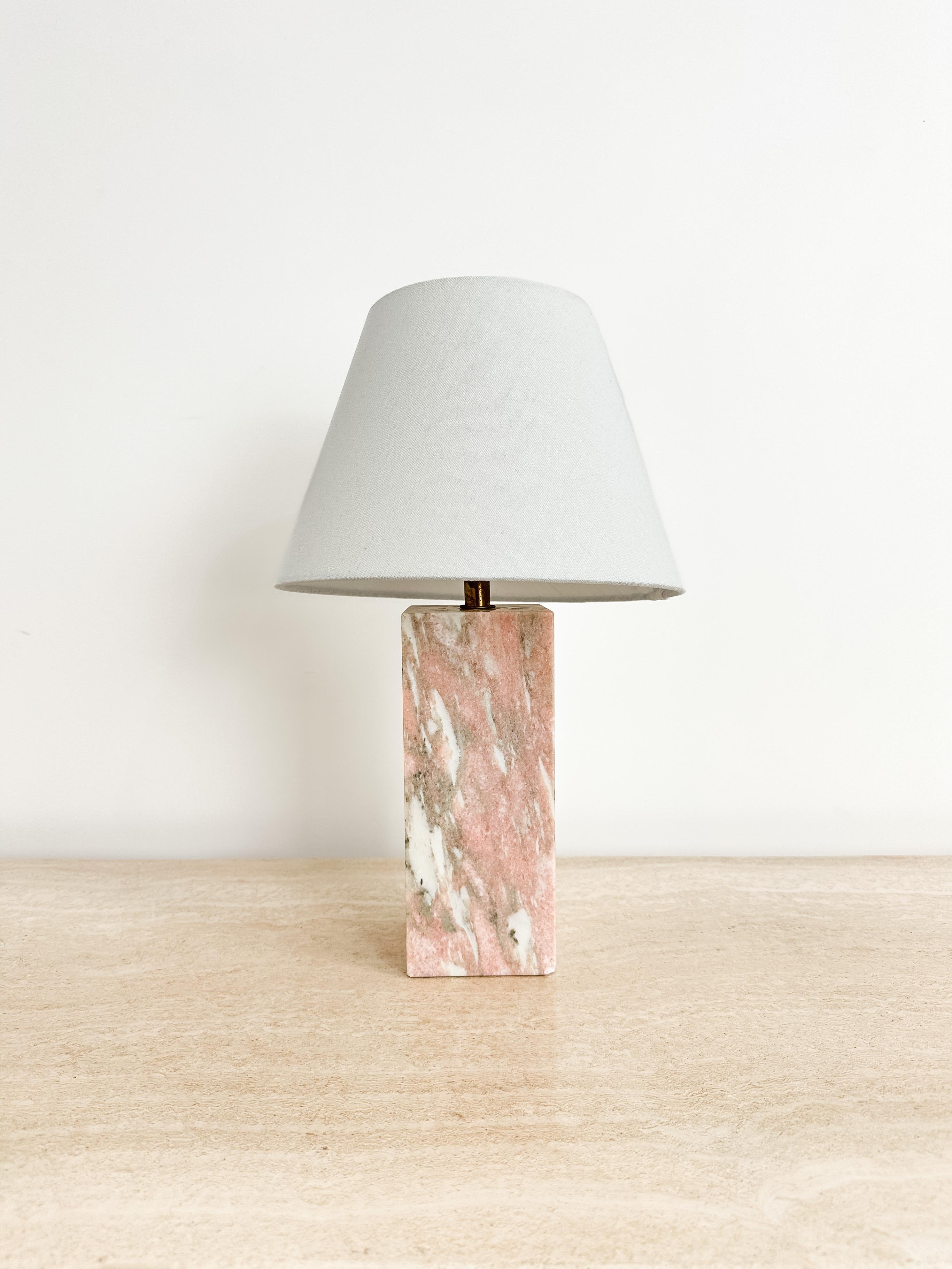 Carved from a solid block of Norwegian Rose marble, this 1950s table lamp is a refined study in form, material, and mid-century craftsmanship. Produced by the Vermont Marble Company of Proctor—one of America’s most respected marble manufacturers—the