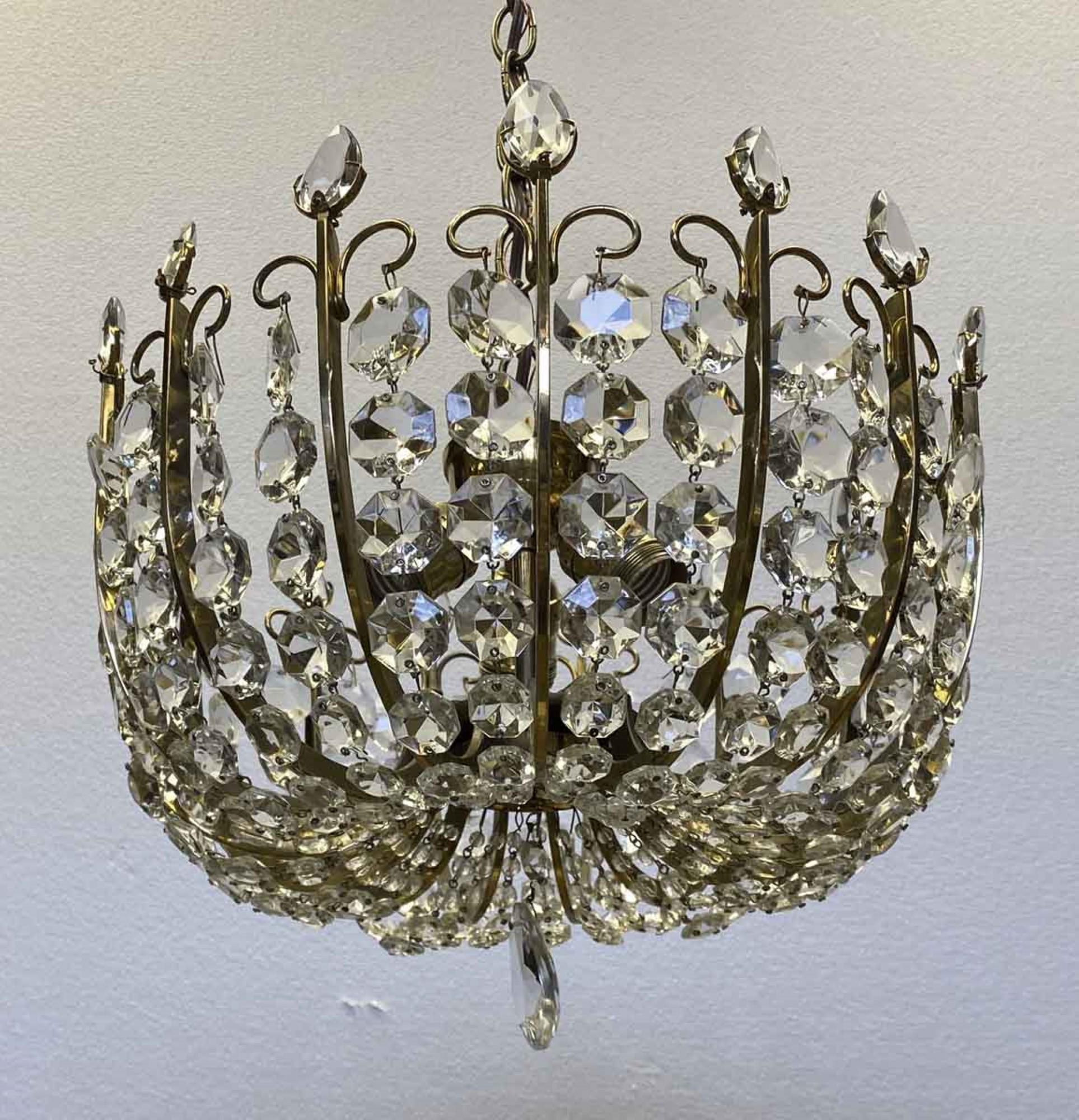 From the 39th floor of the NYC Waldorf Astoria Towers, this is a 20th century mid-century Italian crystal semi flush mount basket chandelier. Waldorf Astoria authenticity card included with your purchase. Small quantity available at time of posting.