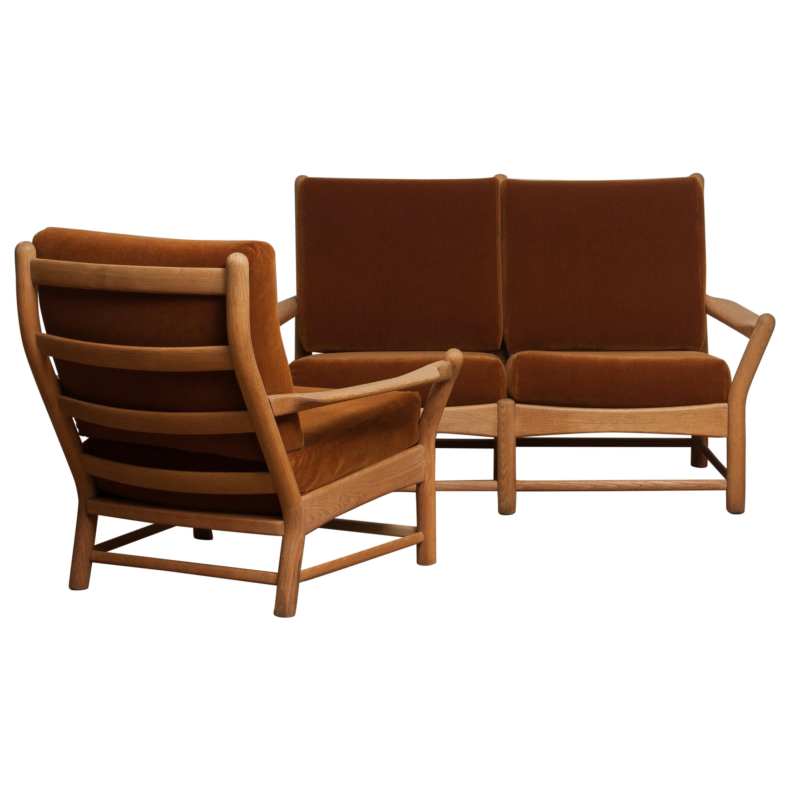 Beautiful two-seat sofa and chair, made in Denmark.
This lounge set is made of oakwood with brown velvet cushions.
It is in a very nice condition.
Period: 1950s.