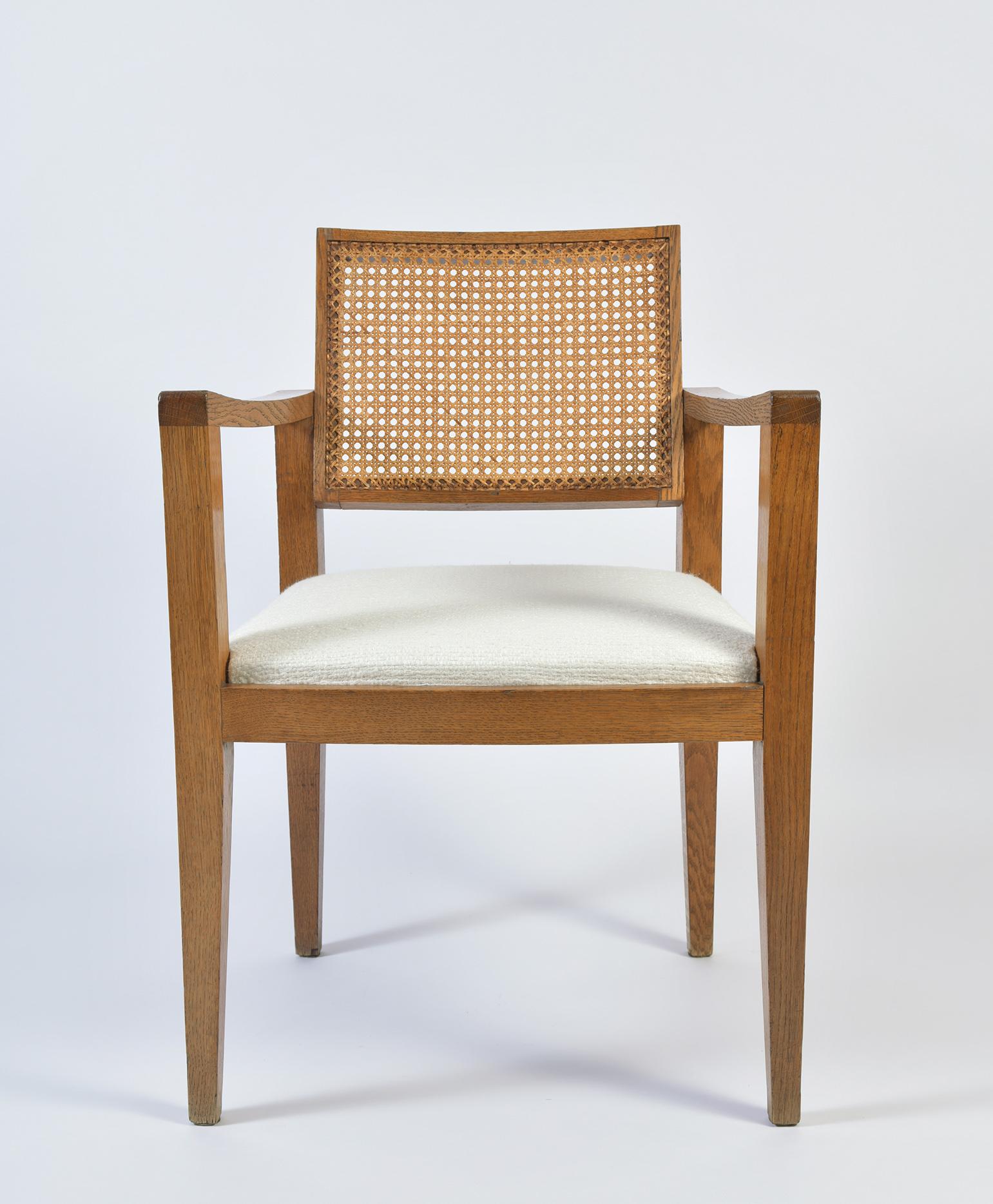 A French post war reconstruction blond oak and cane armchair by Emile Seigneur.
France, circa 1950.

Alumnus of the Ecole Boulle, Emile Seigneur followed the steps of Marcel Gascoin, Jacques Hauville and Roger Landault, by designing post war