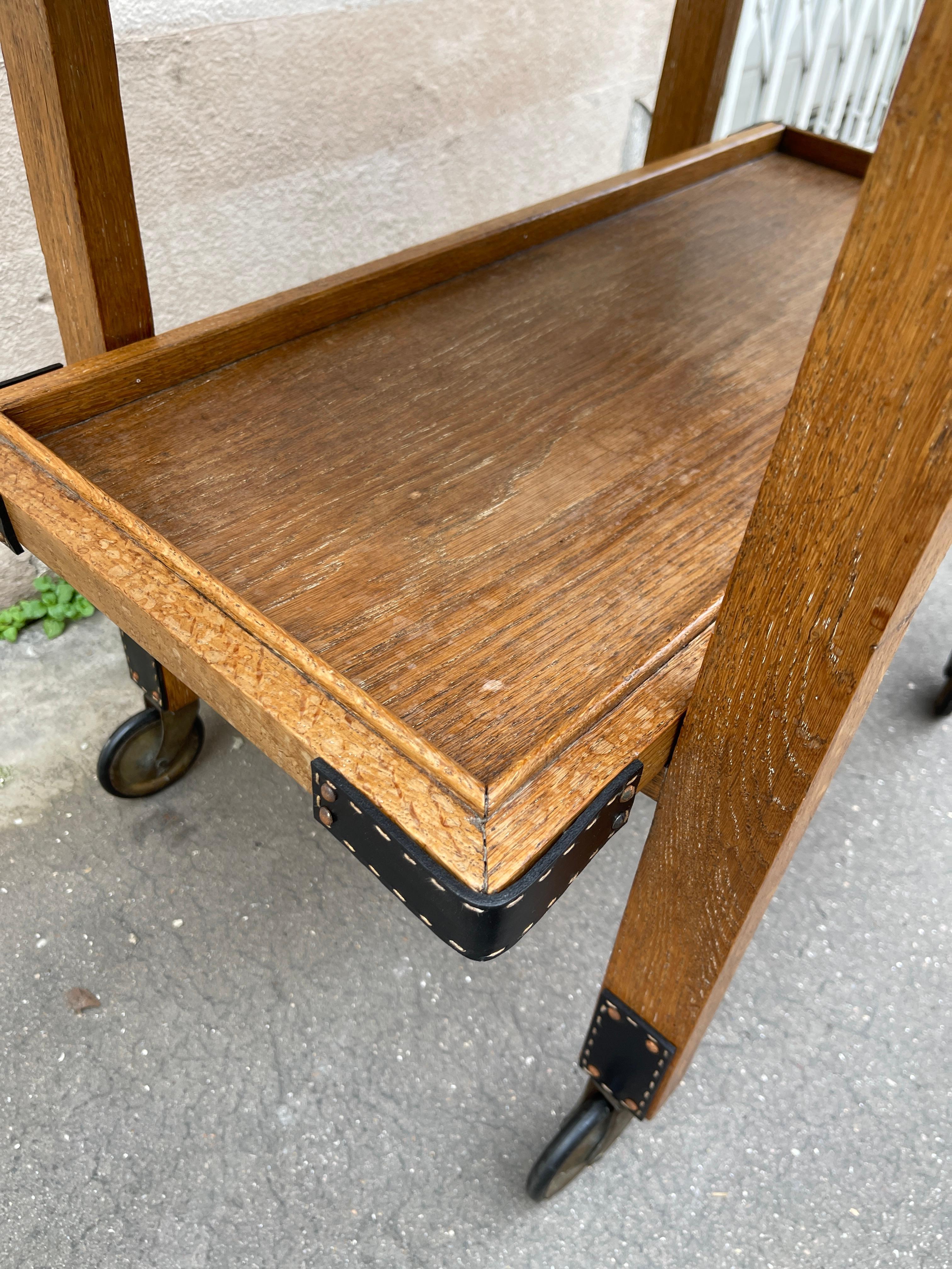 1950's Oak and stitched leather bar cart by Jacques Adnet For Sale 4