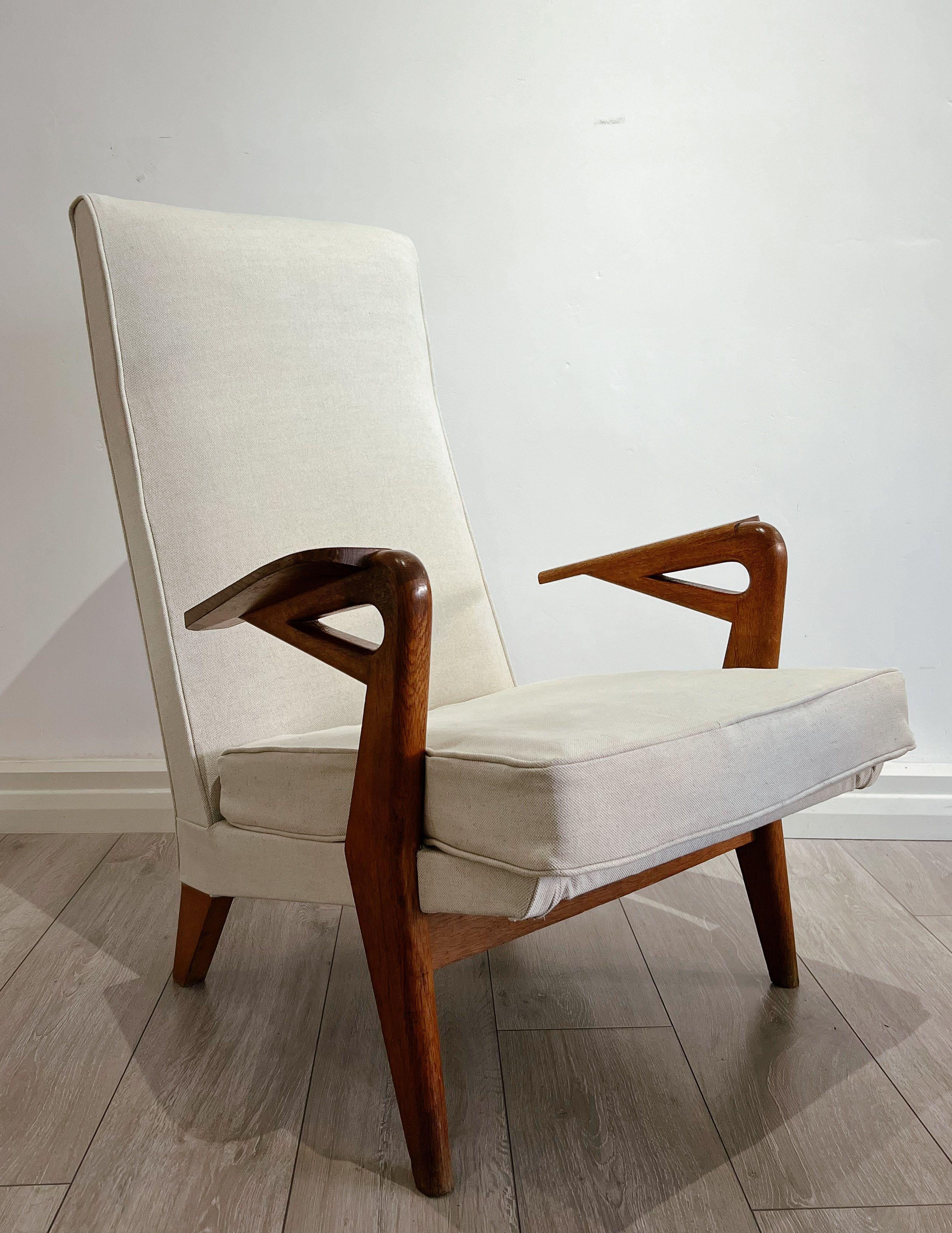 A Great Combination of French and British Design and craftsmanship. 

The chair is beautifully made with a very distinctive 1950s design. Parker Knoll moved some manufacturing from Germany to France after the war and that is how I believe the design