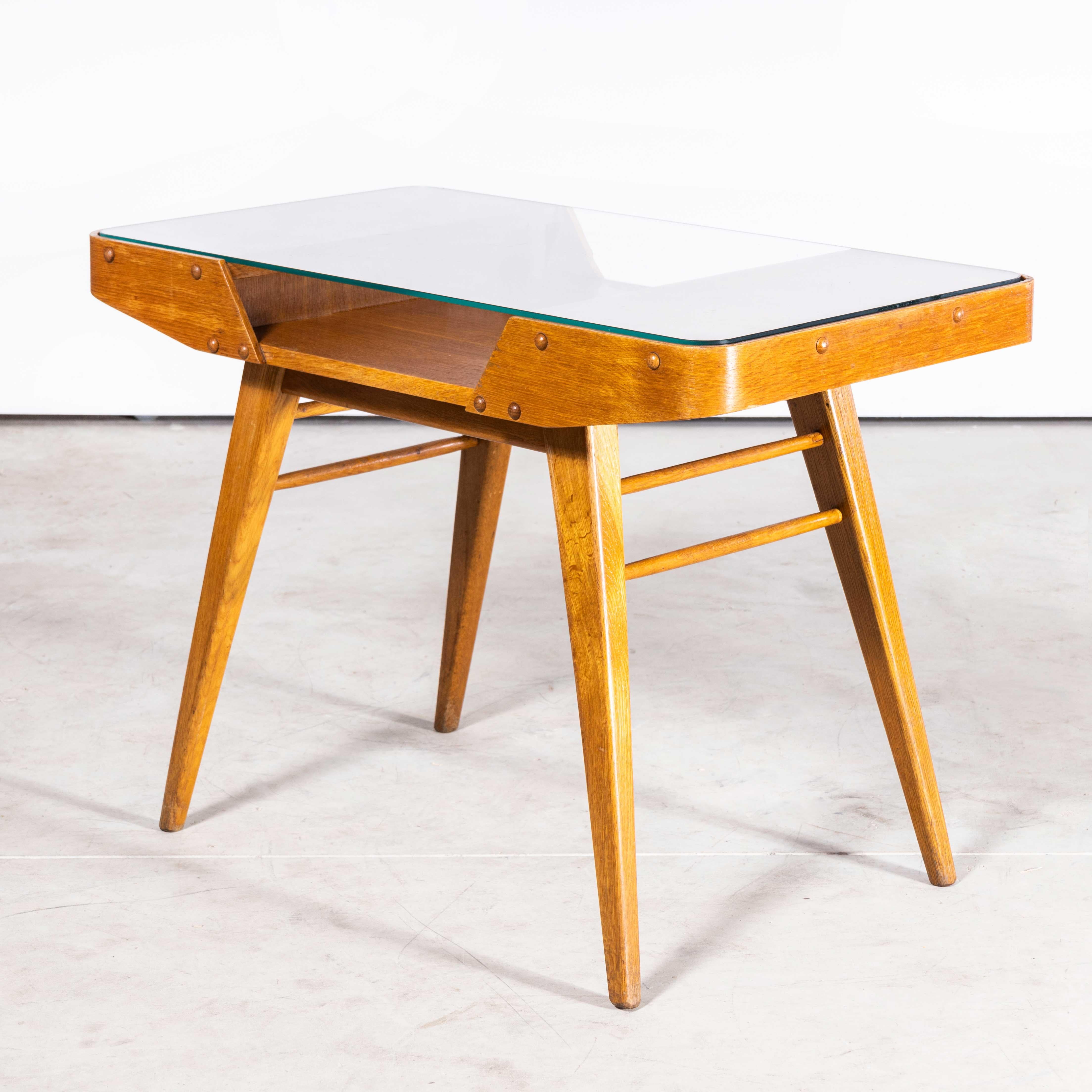 1950s Oak Framed Side Table With Glass Top
1950s Oak Framed Side Table With Glass Top. Beautiful simple and Classic midcentury side table sourced in the Czech Republic. Czech design will always be affiliated to the Bauhaus movement which inspired a