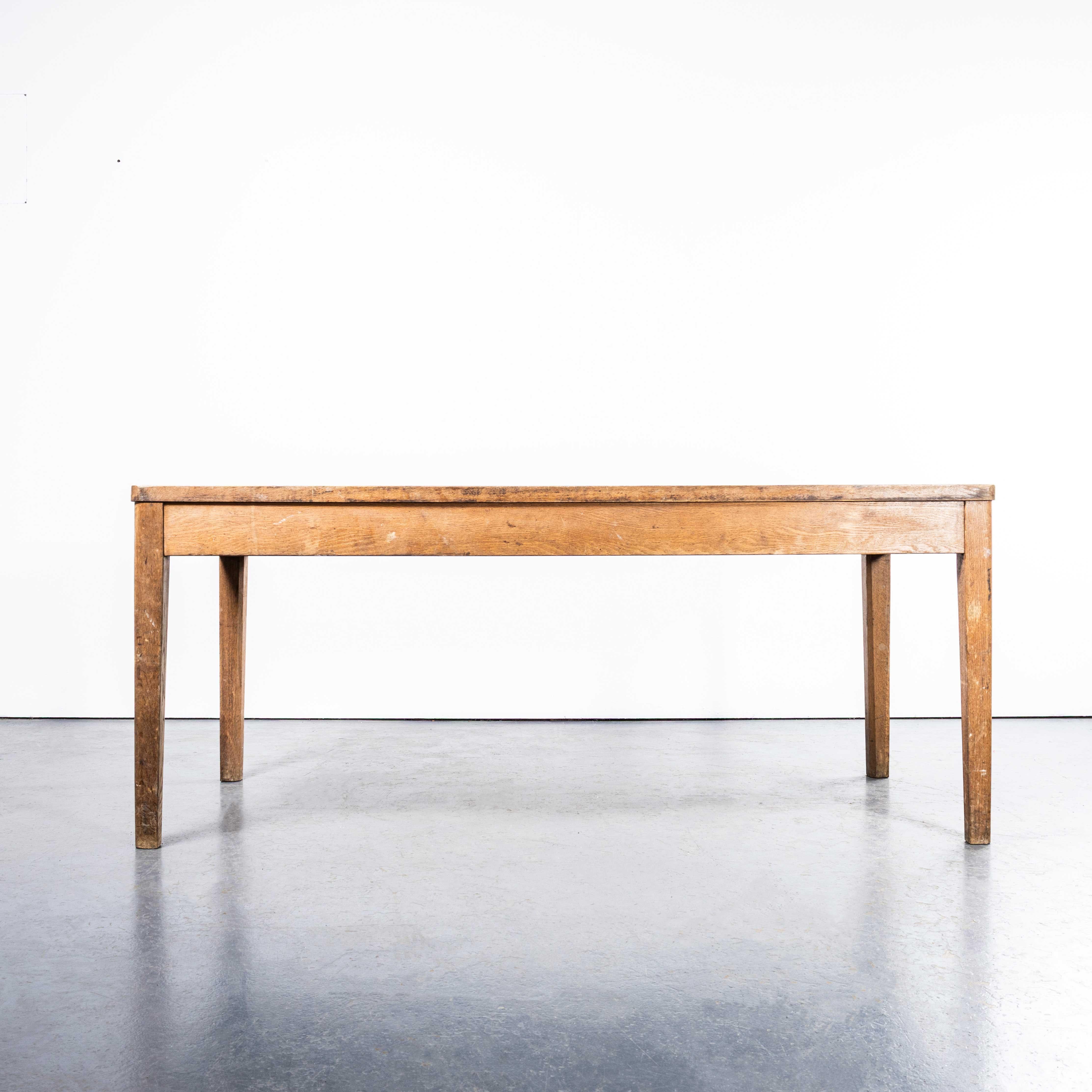 1950’s Oak Linoleum Top School Art Room Dining Table. 
Classic 1950’s school table either from an art room or dining hall. The frame is oak, the top a light oak matched linoleum. Our workshop has serviced the tables it has been cleaned and lightly