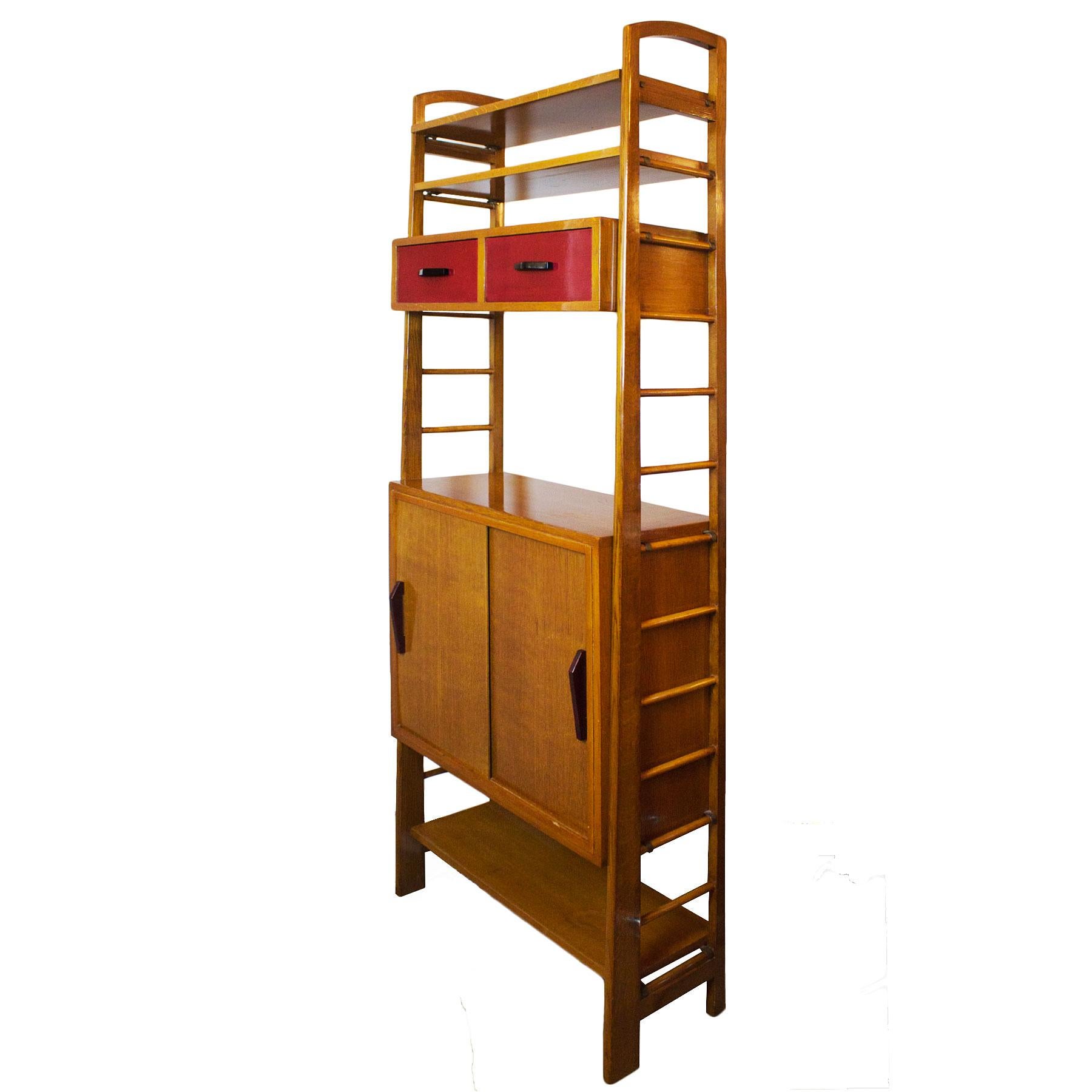 Oak modulus storage cabinet with red lacquered drawers, sliding doors and shelves.

France, circa 1950.