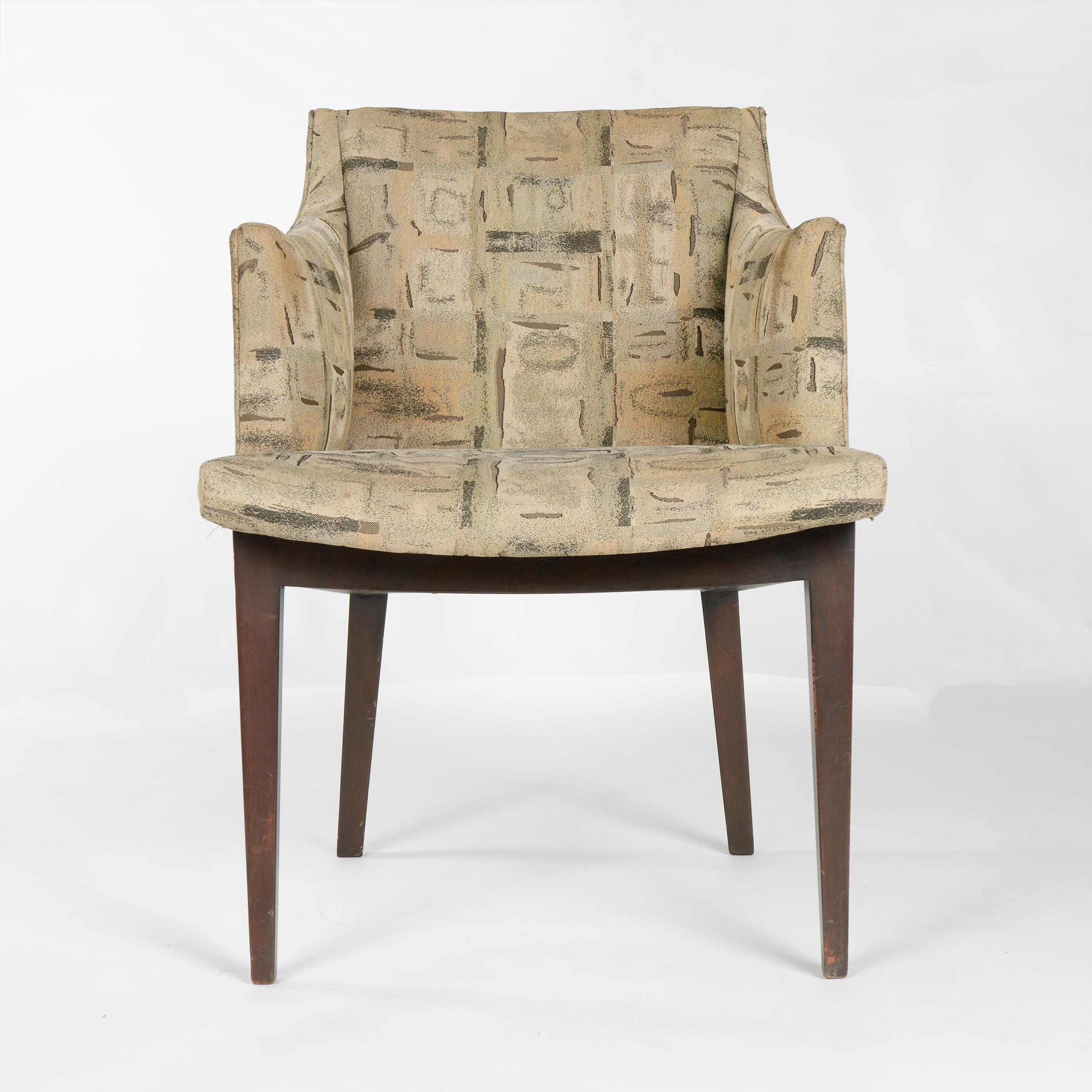 A model 5517 occasional armchair with exposed mahogany frame supporting a fully upholstered seat, back rest and arms, covered in vintage upholstery. Designed in 1954 as a component of the Hemisphere Collection, introduced in 1955 at the Chicago