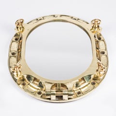1950's ocean liner porthole with the opening window fitted with a mirror