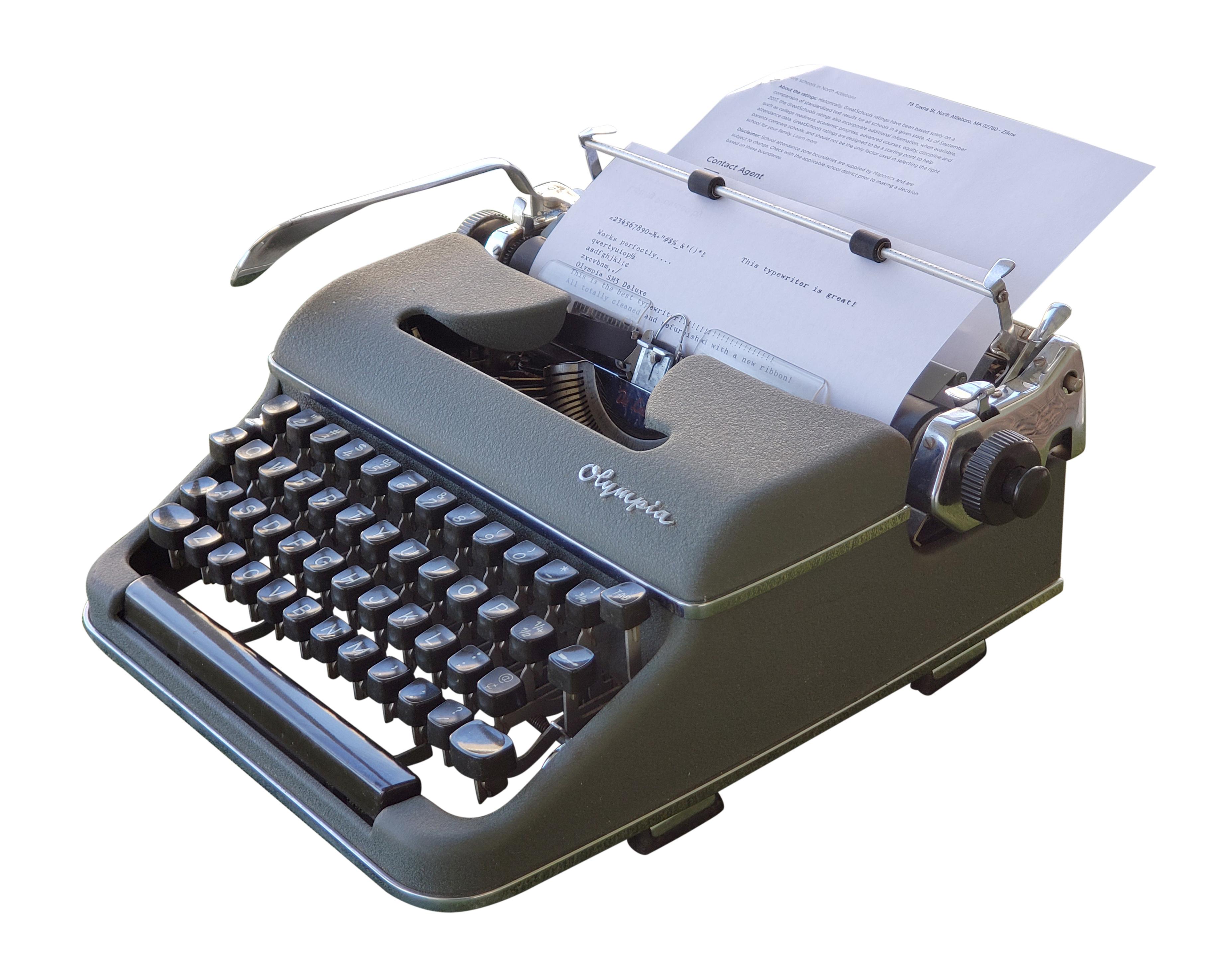 Vintage Olympia De Luxe green typewriter with original gray case. This typewriter has been professionally serviced and is in excellent working condition. This can be viewed at our Scranton, Pennsylvania location. Please inquire for the exact address.