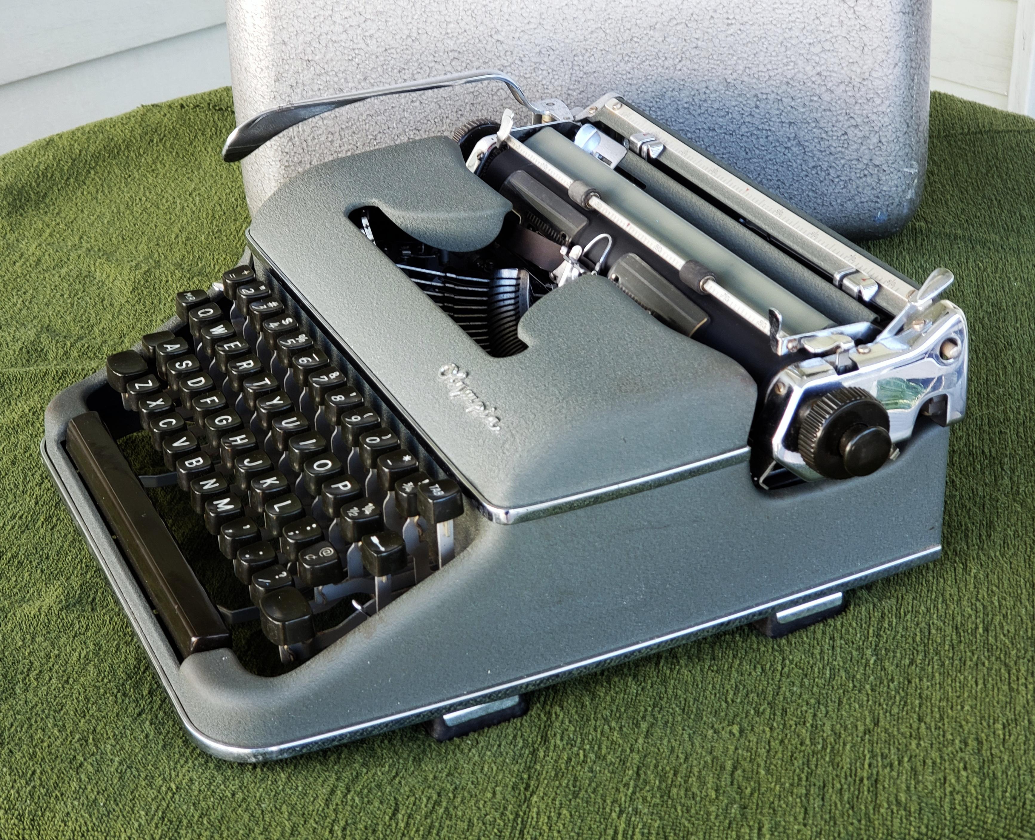 Metal 1950s Olympia SM3 De Luxe Typewriter with Hard Case