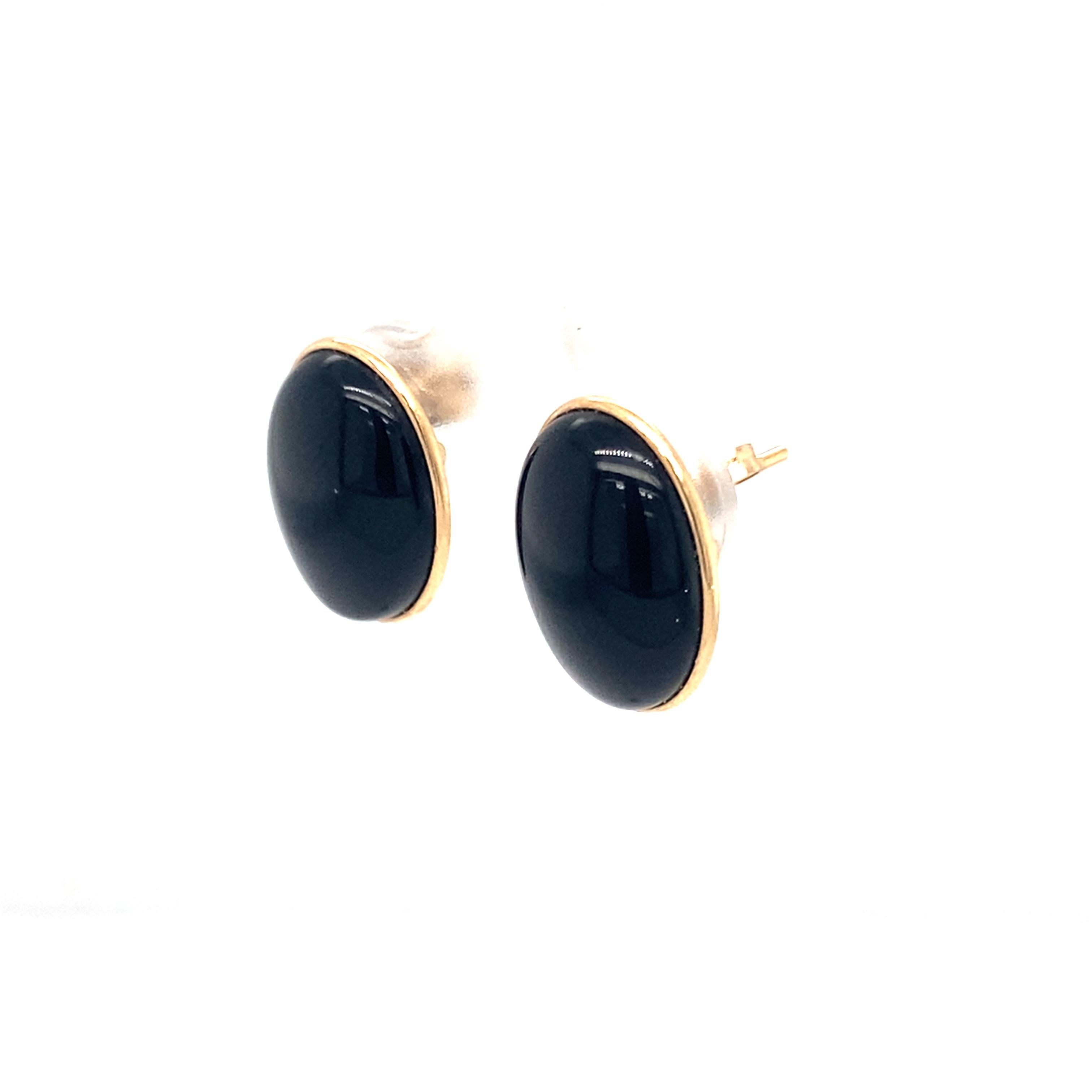 Item Details:
Gemstone: Onyx
Metal: 14 Karat Yellow Gold
Weight: 2.4 grams
Hallmark: 14K
Dimensions: 15 millimeters x 11 millimeters

Onyx Details:
Cut: Cabochon Oval
Color: Black

Item Features:
These beautiful Black oval Onyx stud Earrings are