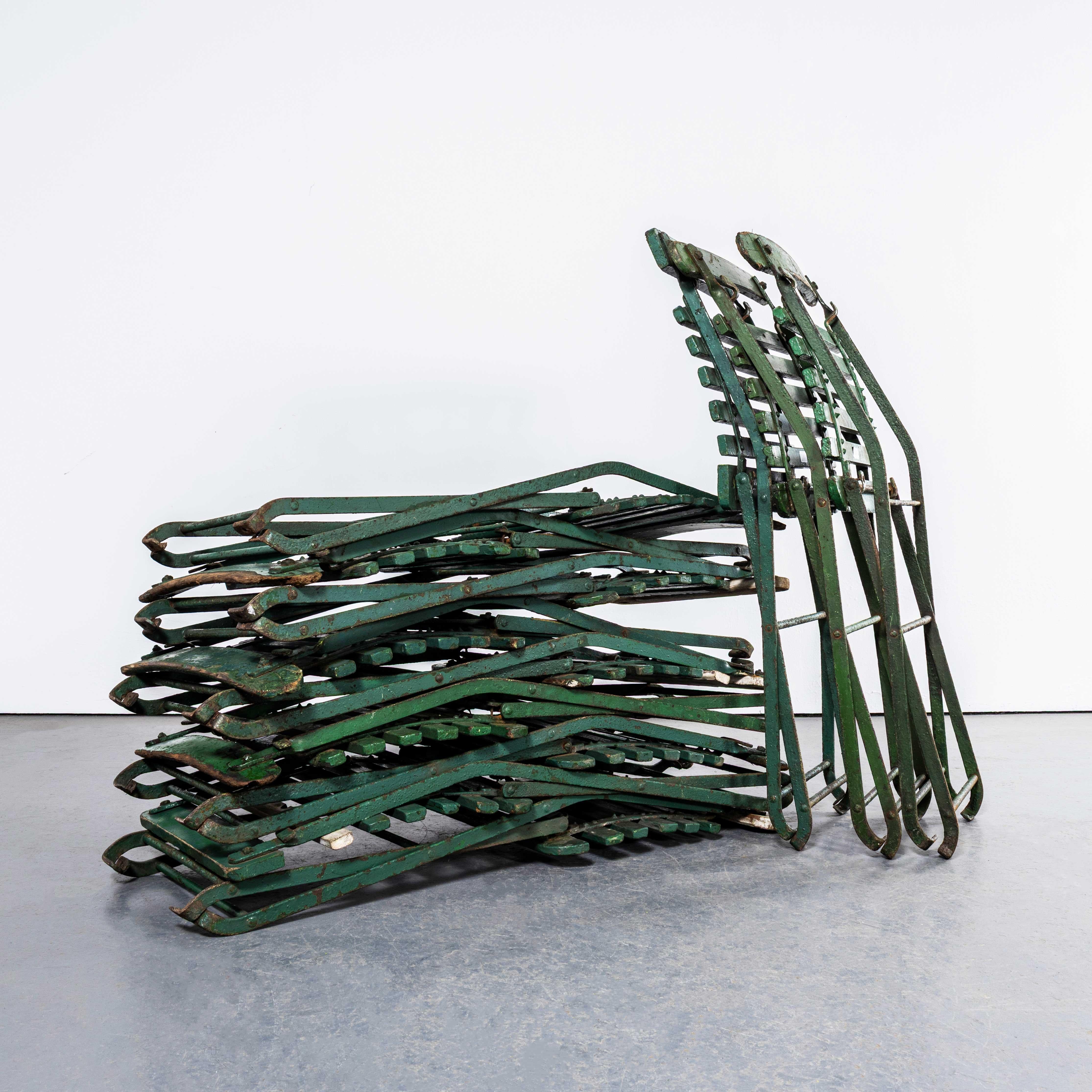 1950’s Original English Pavilion Dark Green Folding Chairs. 

We sourced these from a dusty community hall in Nottinghamshire where they had been stored for many years, having been removed from a local cricket ground. Classic English heavy weight
