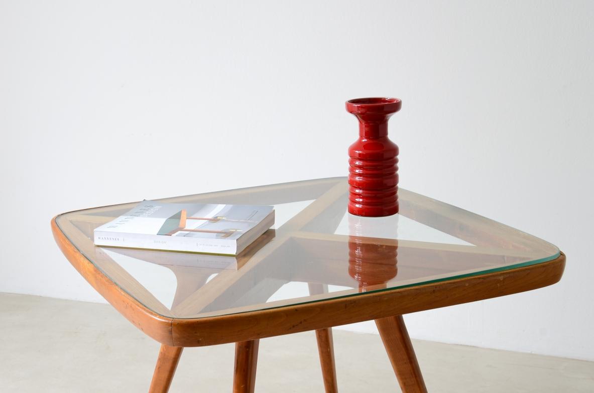 Mid-Century Modern 1950's original entrance or cocktail table with visible cross and glass top For Sale