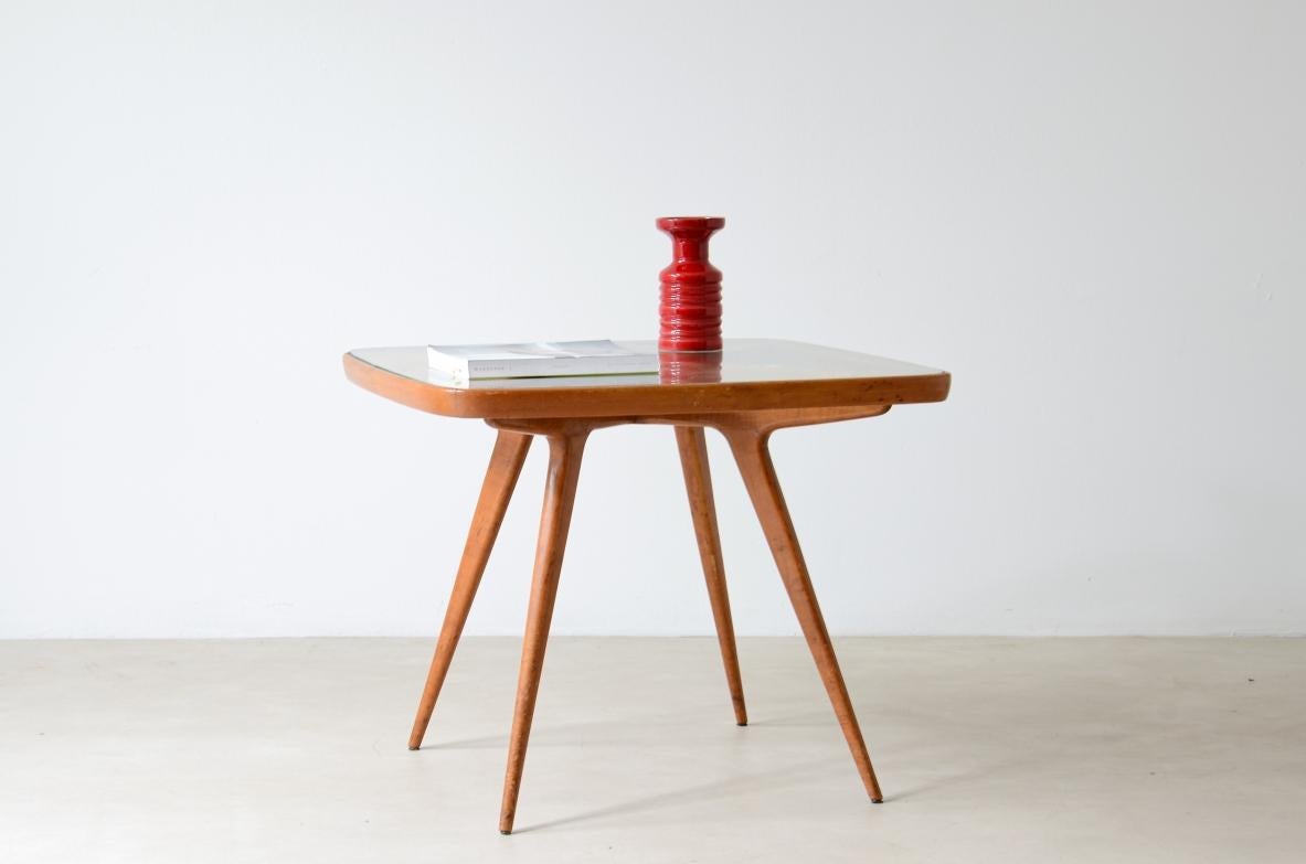 Italian 1950's original entrance or cocktail table with visible cross and glass top For Sale