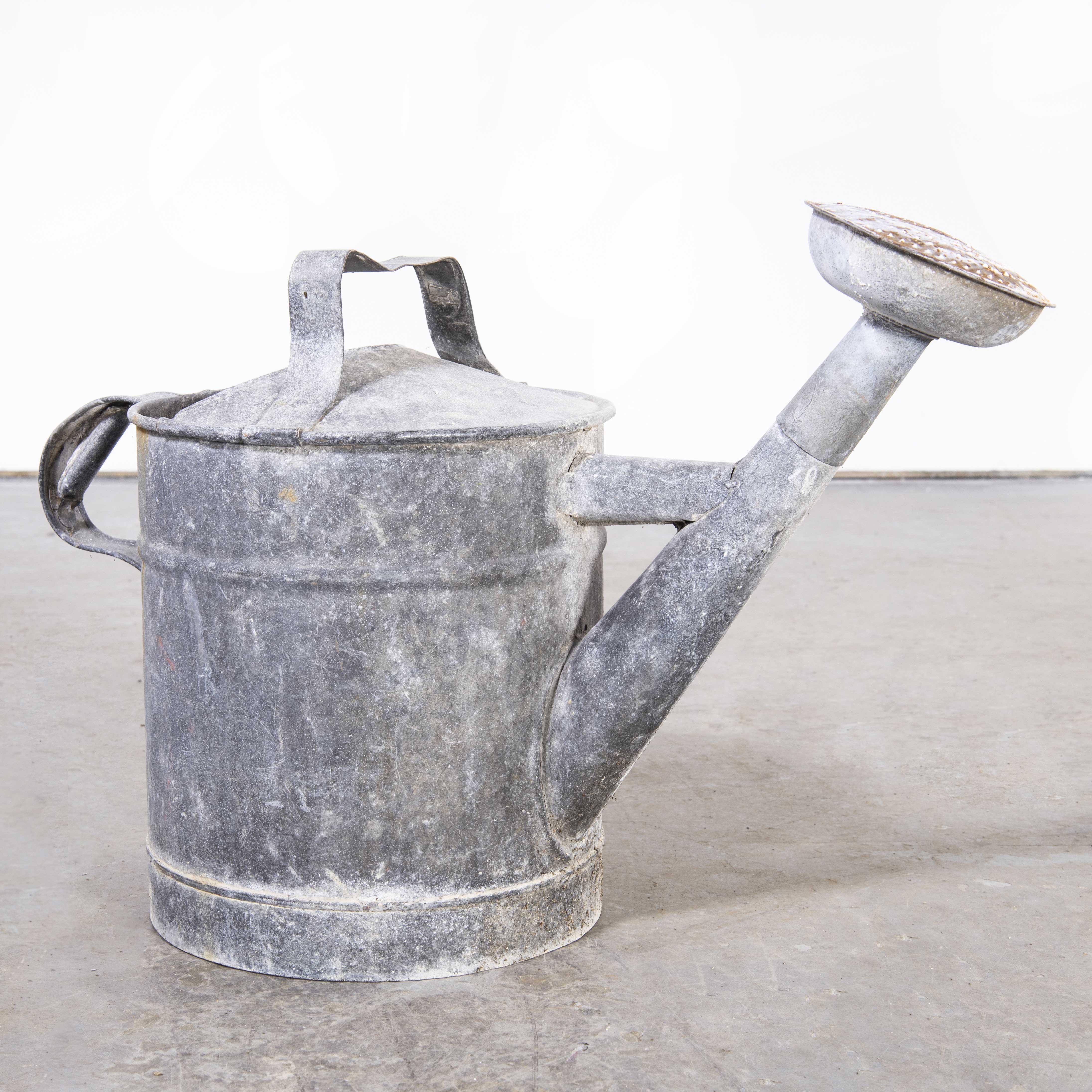 1950’s Original French Galvanised watering can
1950’s Good Size Galvanised Watering Can. Tall well proportioned watering can complete with nozzle. We have a number of original watering cans all in good condition, they all hold water and are sold