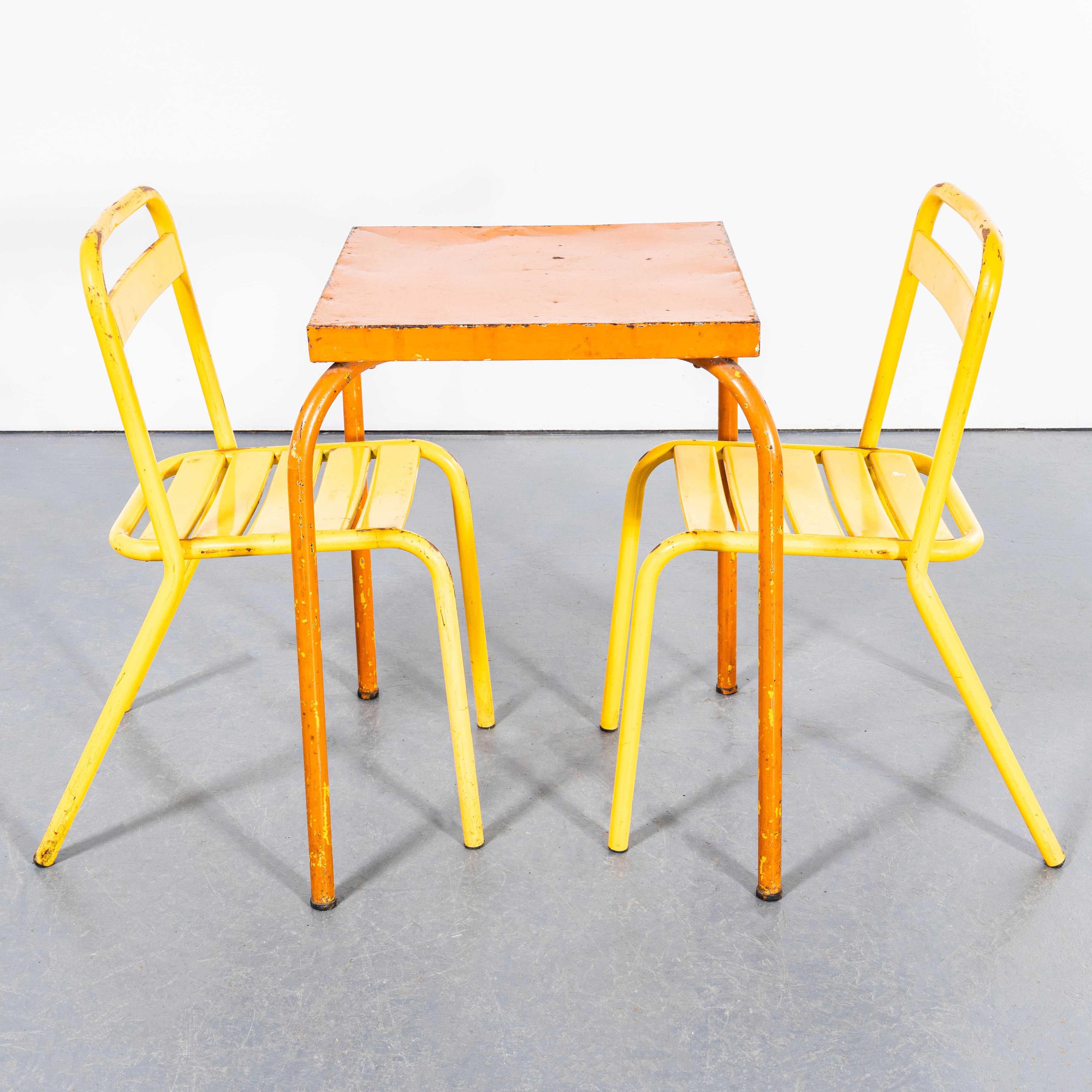 1950's Original French Outdoor Table And Chair Set - Two Chairs. 

This listing is for one metal table and two metal garden chairs, as photographed. The chairs are classic Toledo garden chairs made famous in France as they were often supplied at