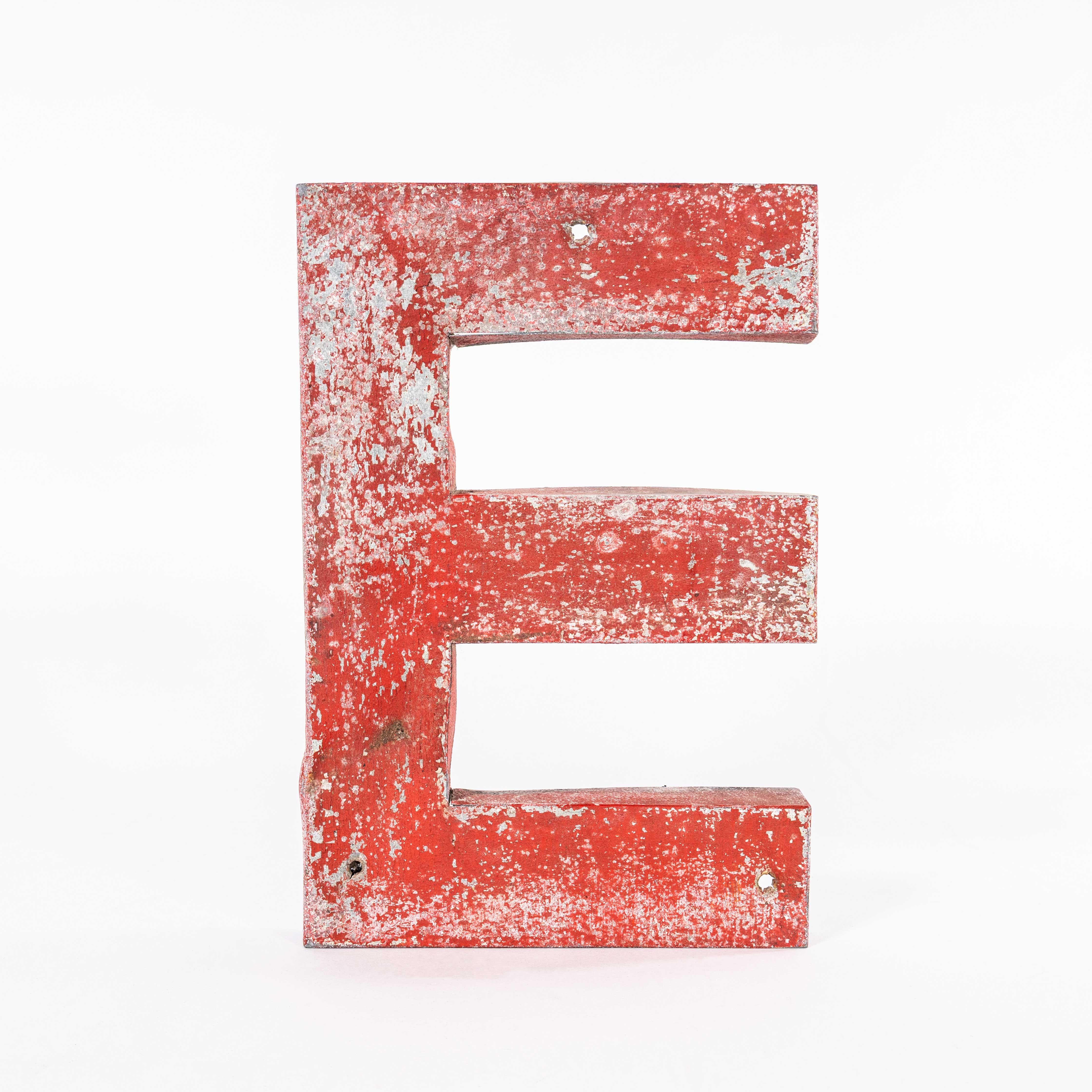 1950’s Original French Red Zinc Letter – E. 
We have a number of these well aged zinc letters. The letters have been handmade in sheet steel and zinc dipped. The letters are hollow on the reverse. This listing is for one letter only as specified in