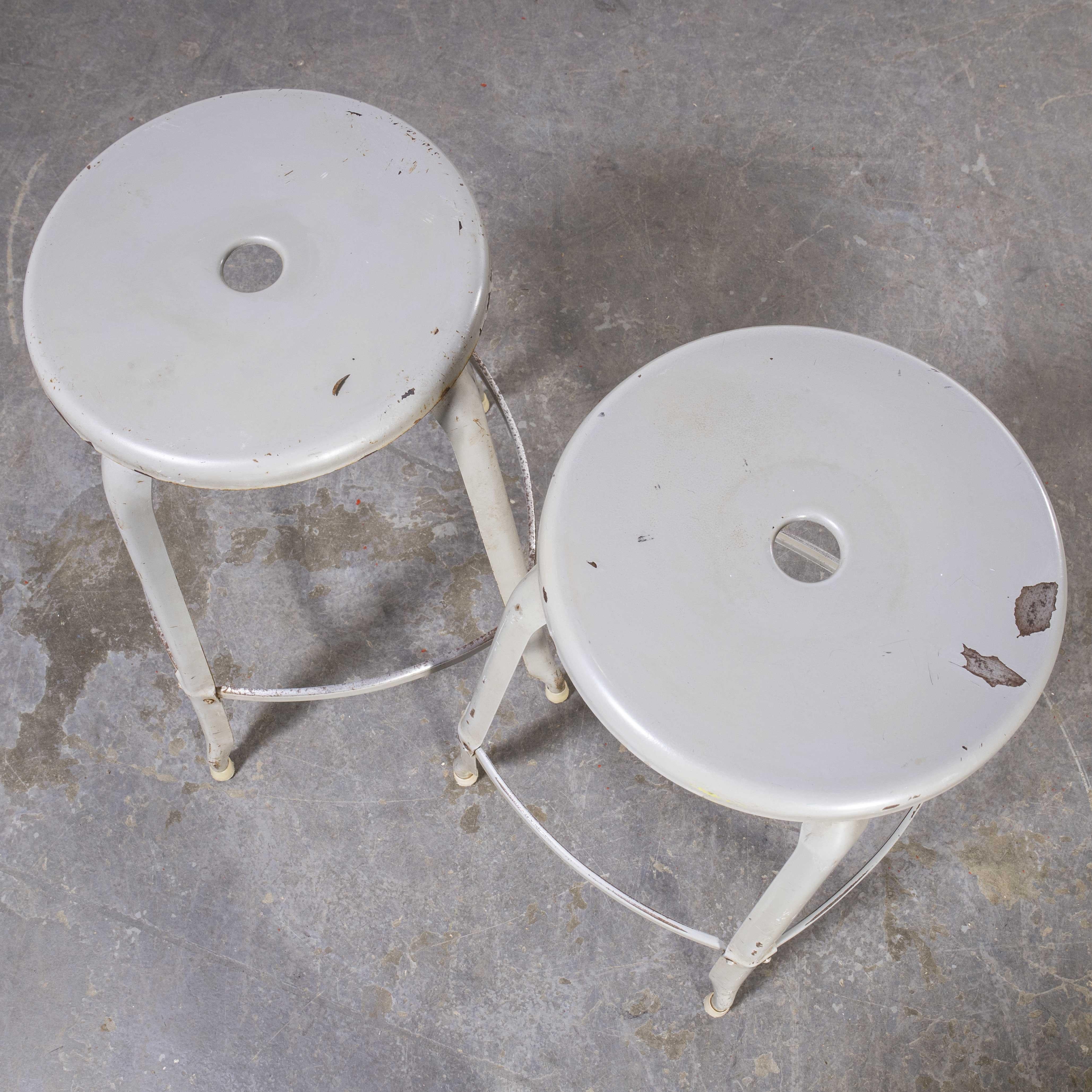 1950’s Original industrial Nicolle stacking stools, pair.

1950’s Original industrial Nicolle stacking stools, pair. One of our all time favourite products, exceptional in design with the minimal use of materials yet strong, well proportioned and