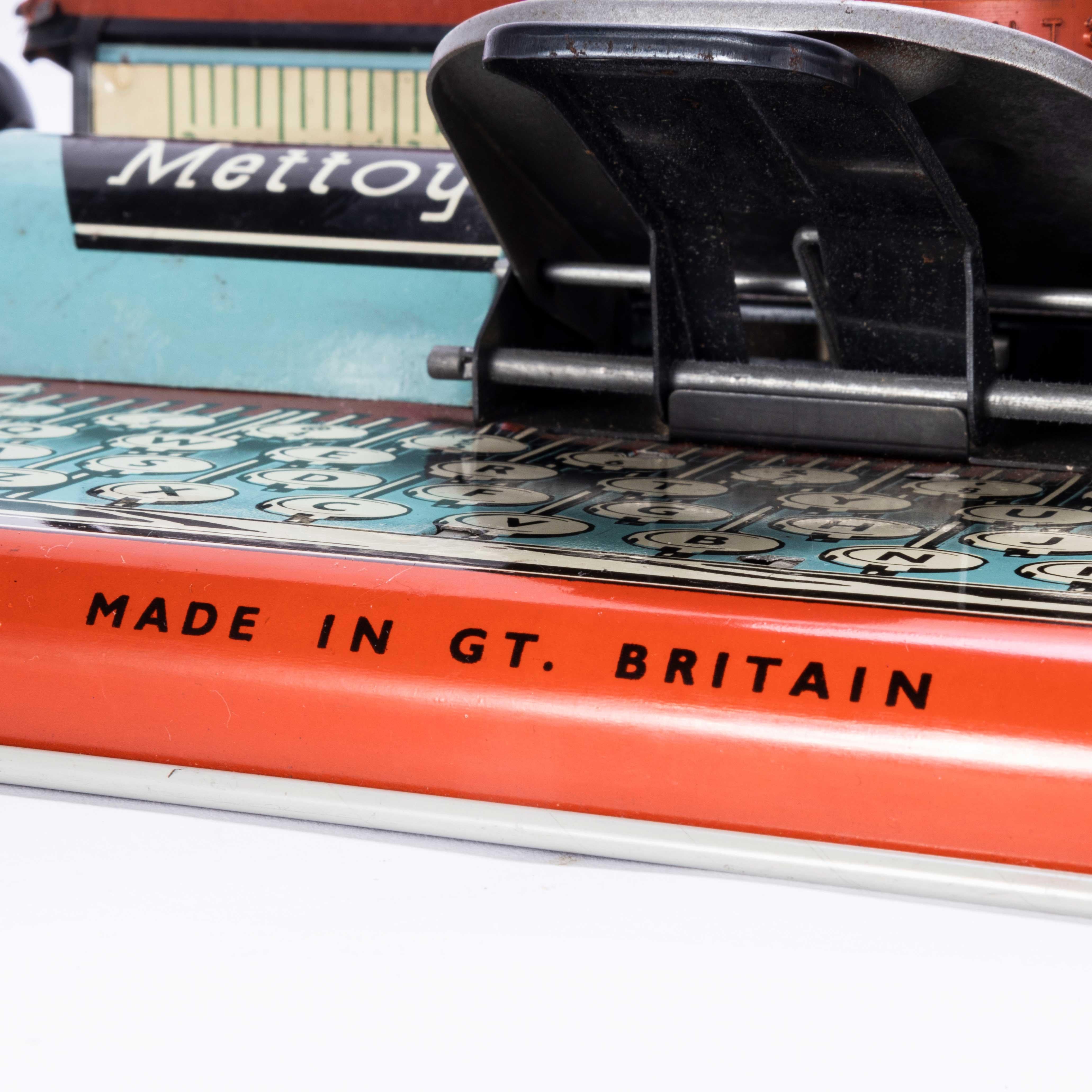 1950's Original Mettoy Minor Typewriter - Boxed. 

Classic Mettoy tin typewriter. Originally the typewriter was designed to work on a basic level, most components are still working although sold as a decorative item only. Comes with original