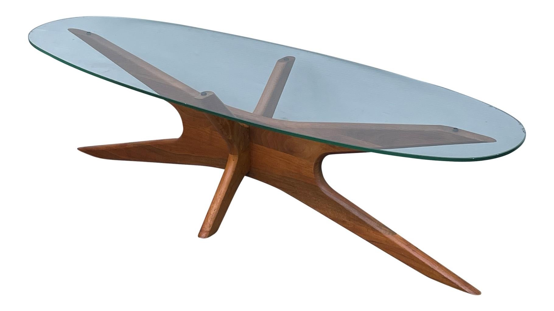 Mid-Century Modern atomic walnut and elliptical glass sculptural cocktail table Adrian Pearsall for Craft Associates circa 1950s. Come with new glass.